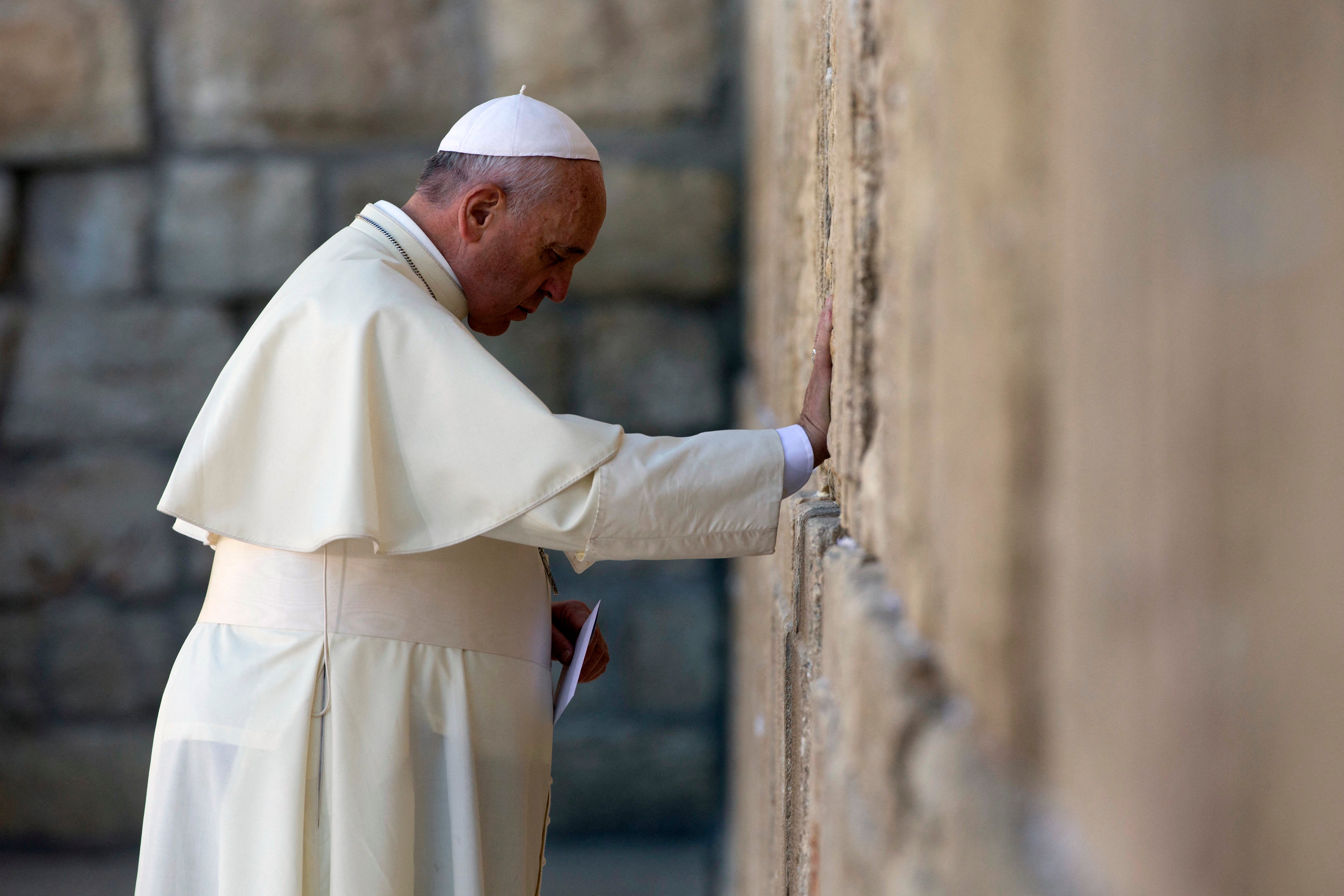 Pope Francis prays at the Western Wall, Judaism’s holiest site, in 2014