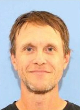Observant neighbors told investigators that suspect Jeffrey Zizz had put a shed together on a property that wasn't his in Olympia.