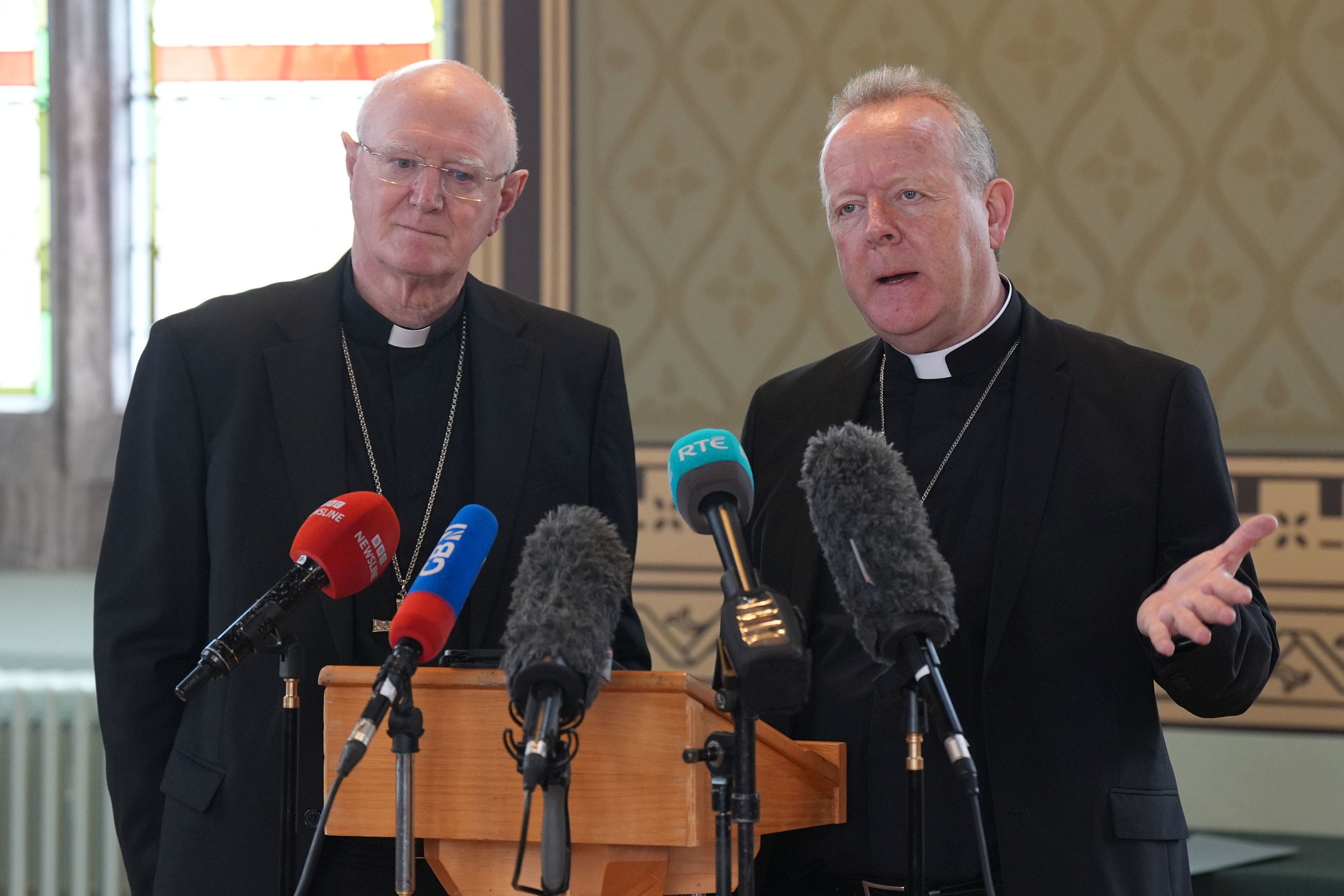 Archbishop of Armagh Eamon Martin, watched by Archbishop Dermot Farrell of Dublin, speaks at a press conference following the death of Pope Francis (Niall Carson/PA)