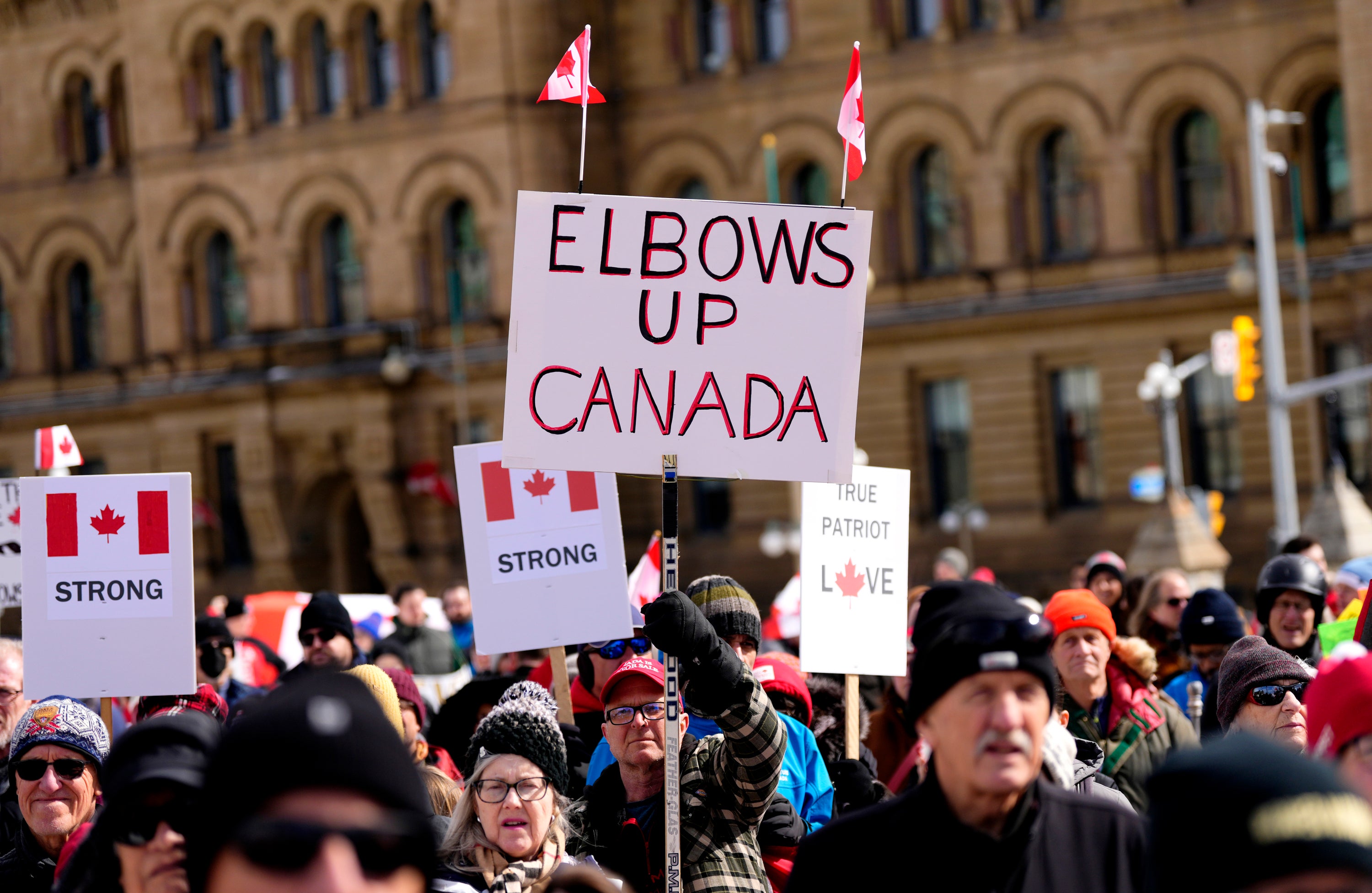 People rally in response to Donald Trump's threats to Canadian sovereignty on Parliament Hill in Ottawa on 9 March 2025