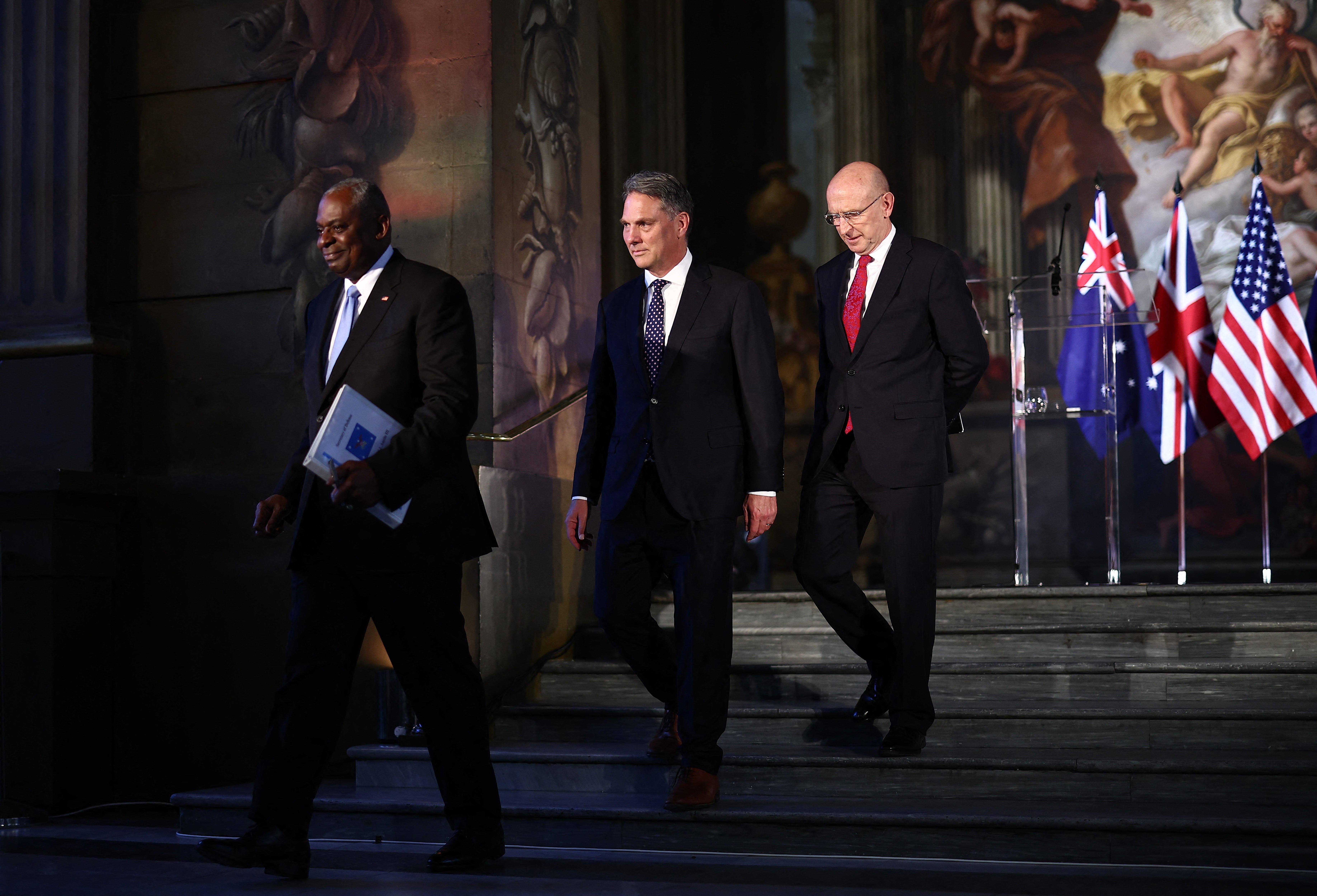 File: Former US defence Secretary Lloyd Austin, Australia's Richard Marles and Britain's defence secretary John Healey leave following a joint press conference during the Aukus Defense Ministerial Meeting in London on 26 September 2024