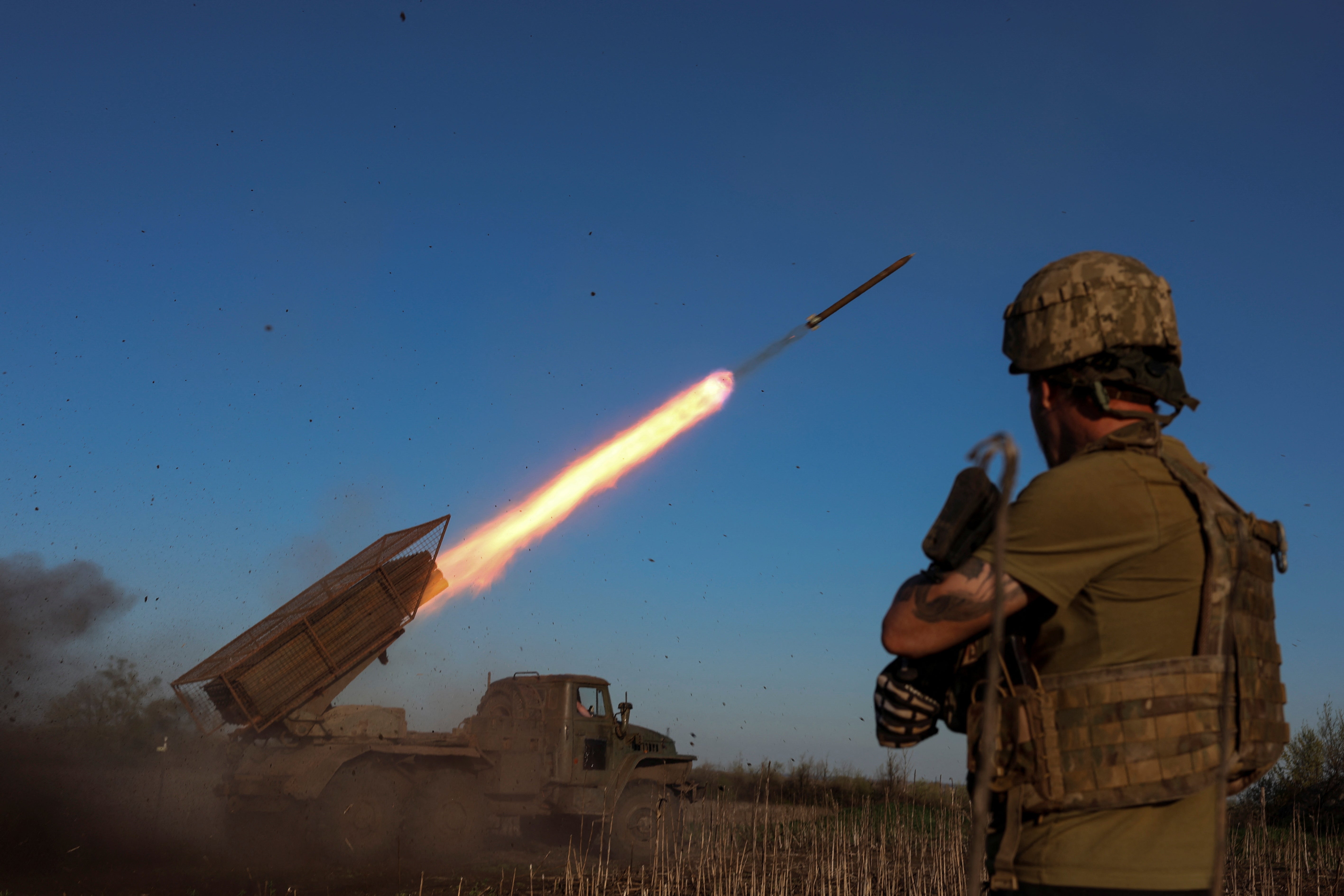 Ukrainian servicemen fire a Grad MLRS towards Russian troops near the frontline town of Pokrovsk