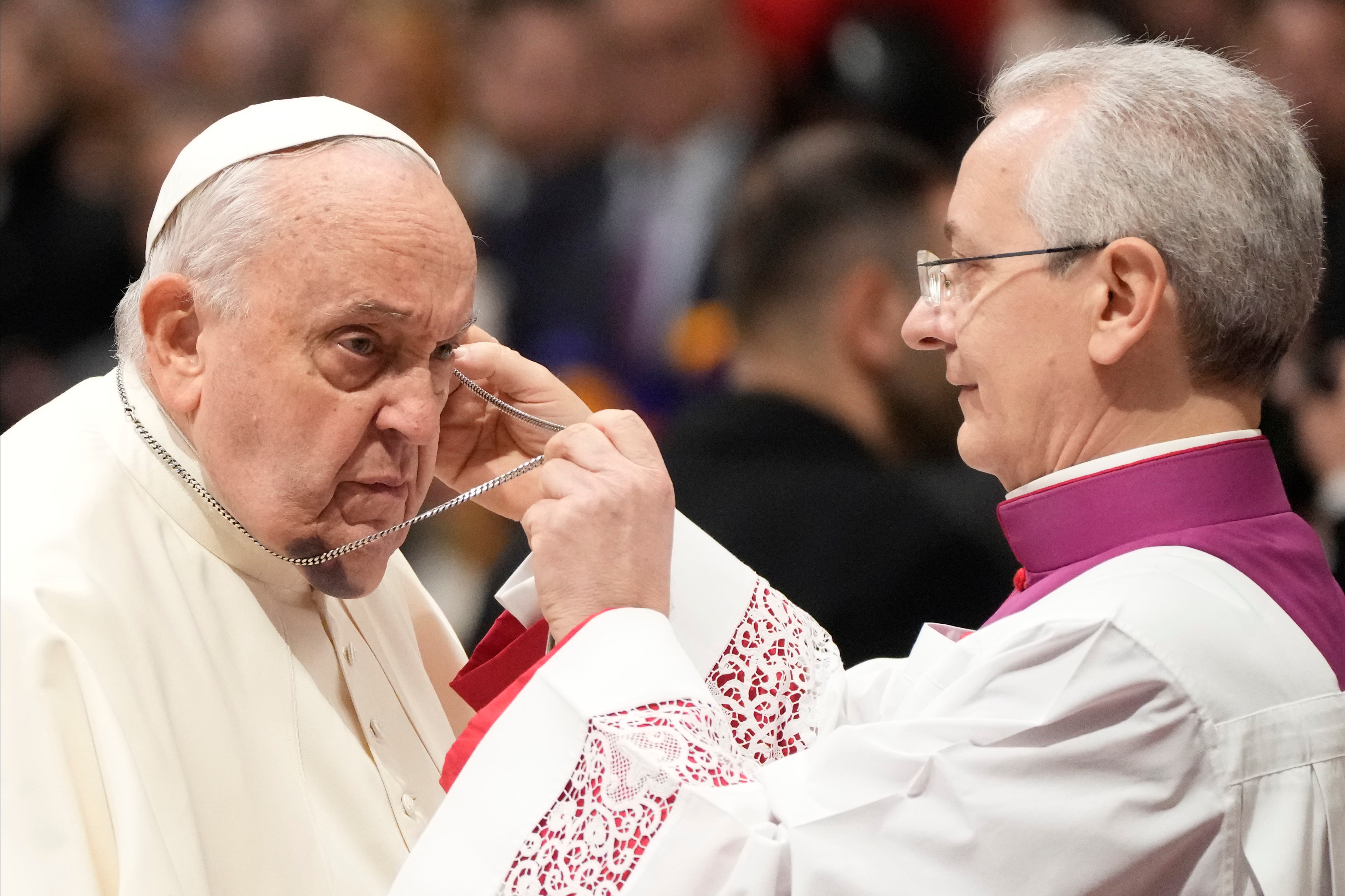 Pope Francis (left) and Archbishop Diego Giovanni Ravelli photographed in St. Peter's Basilica in December