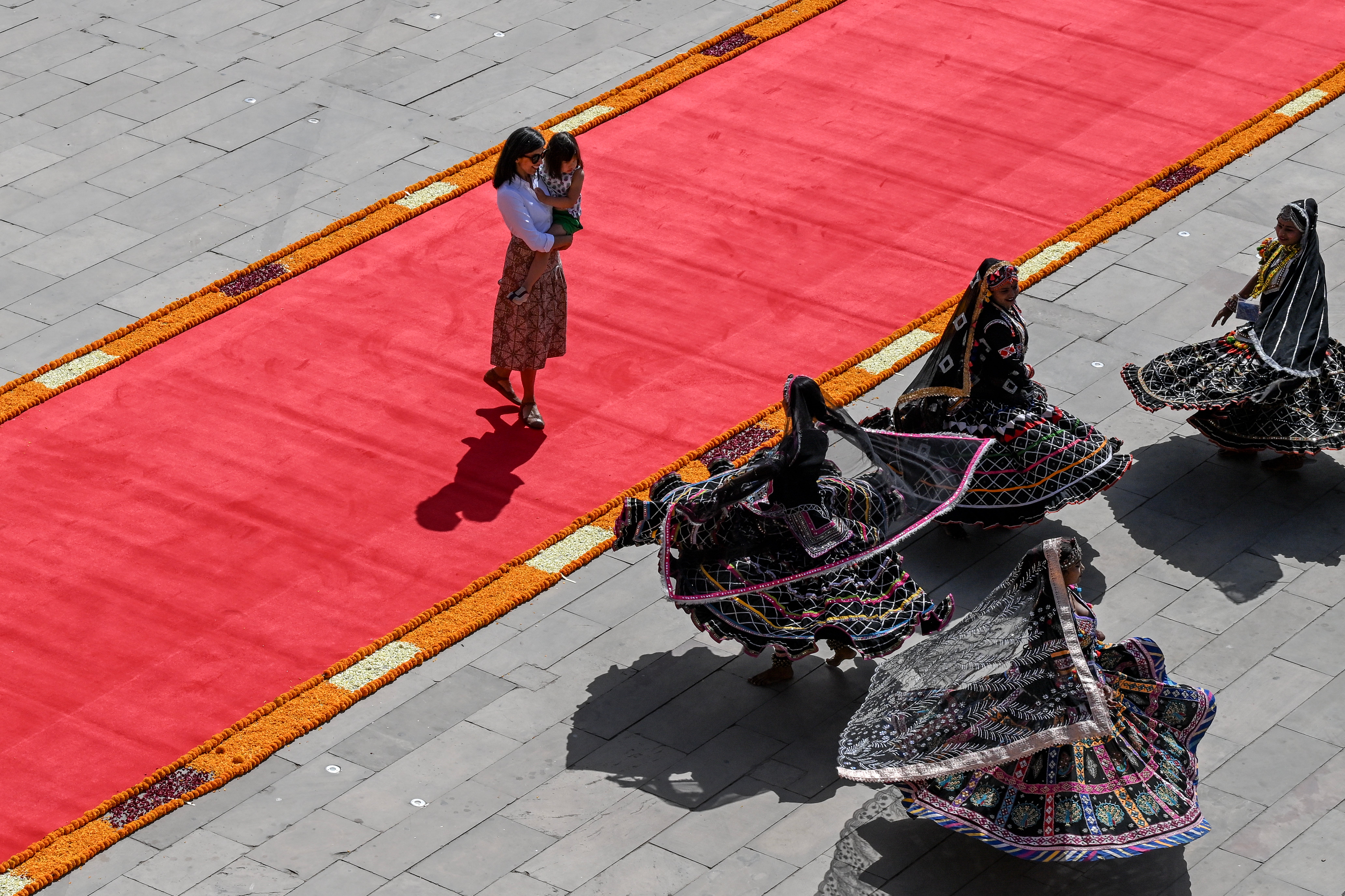 Second Lady Usha Vance, wife of US vice president JD Vance, and their daughter Mirabel watch a cultural performance at the Amber Fort in Jaipur