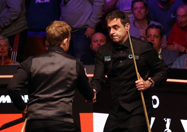 <p>Ronnie O’Sullivan shakes hands with  Ali Carter after a session during their first-round match</p>