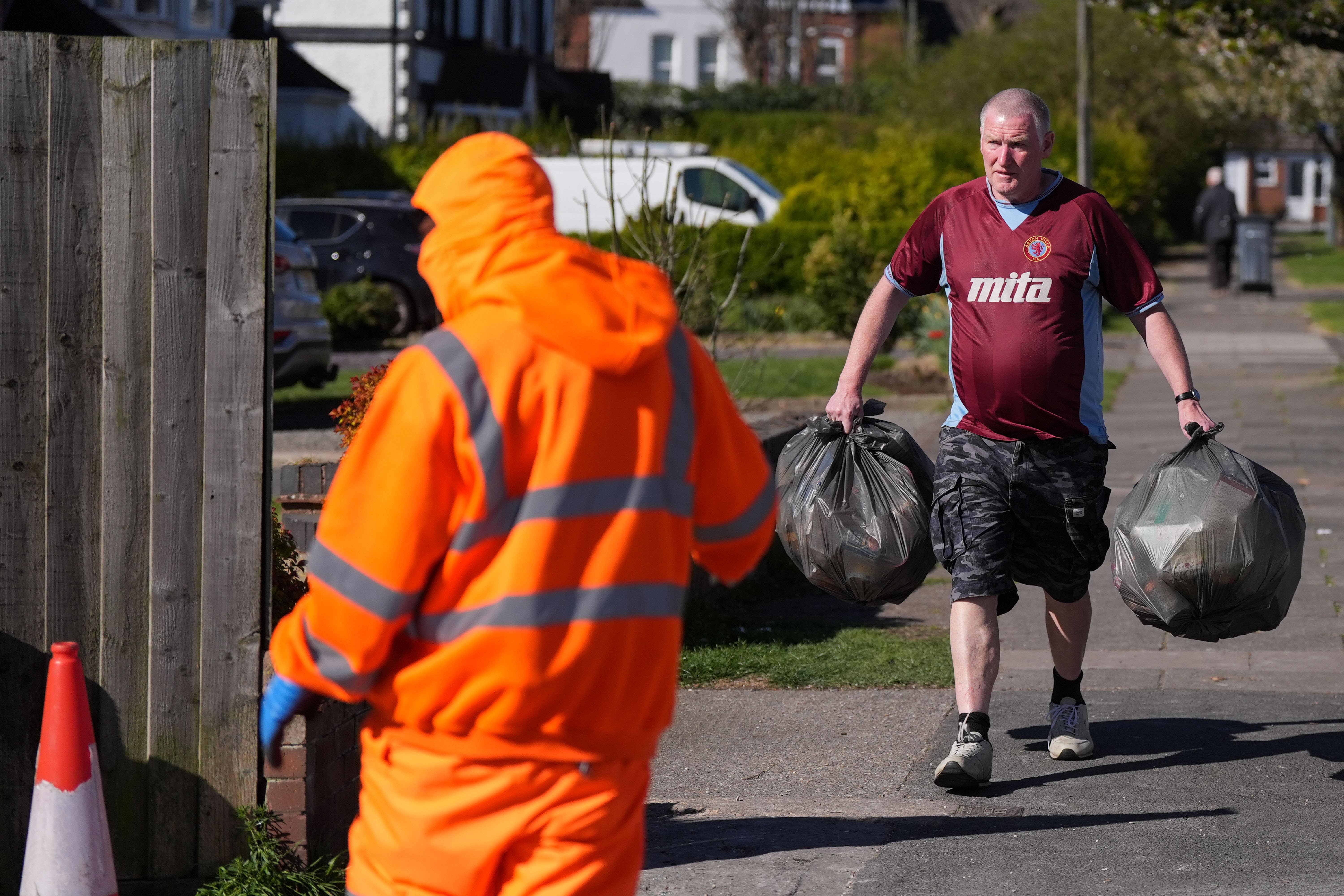 Local residents deliver rubbish to mobile collection vehicles in Erdington, Birmingham (Jacob King/PA)