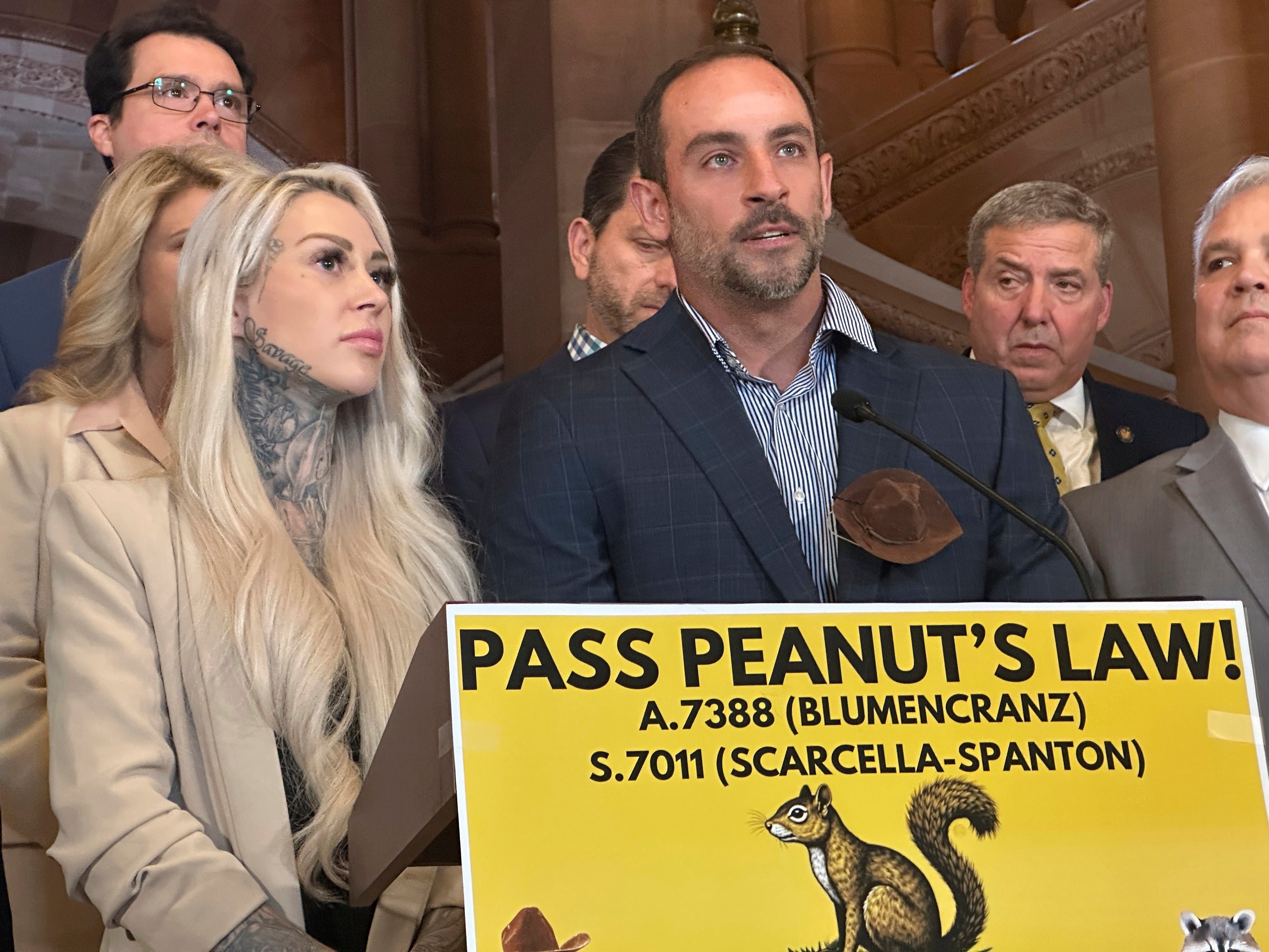 Mark Longo, center, and his wife Daniela Bittner, left, speak during a news conference at the state capitol building, Tuesday, April 8, 2025, in Albany, N.Y. (AP Photo/Michael Hill)