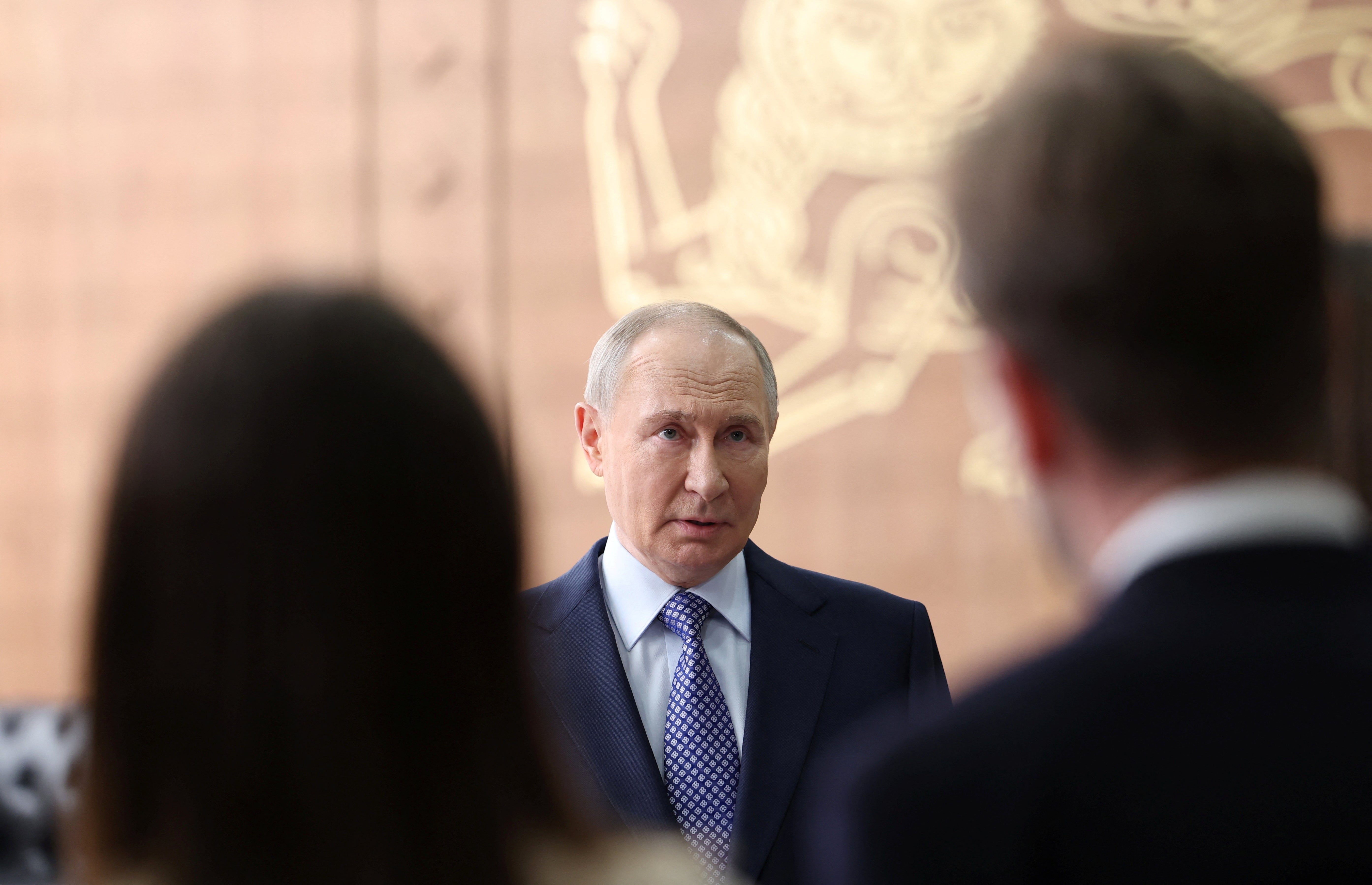Russia's president Vladimir Putin speaks with journalists in Moscow
