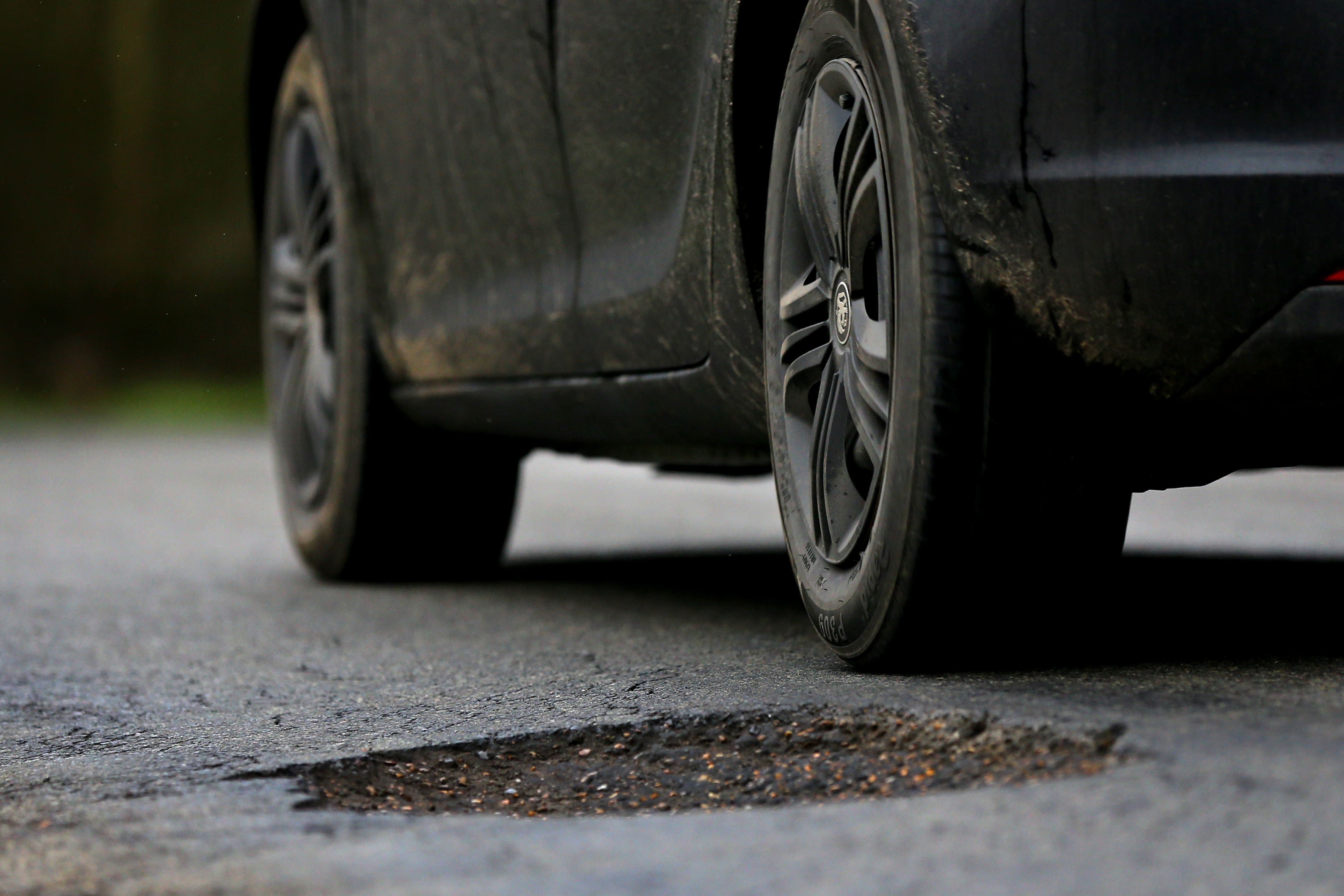 Potholes can cause damaged shock absorbers, broken suspension springs and distorted wheels