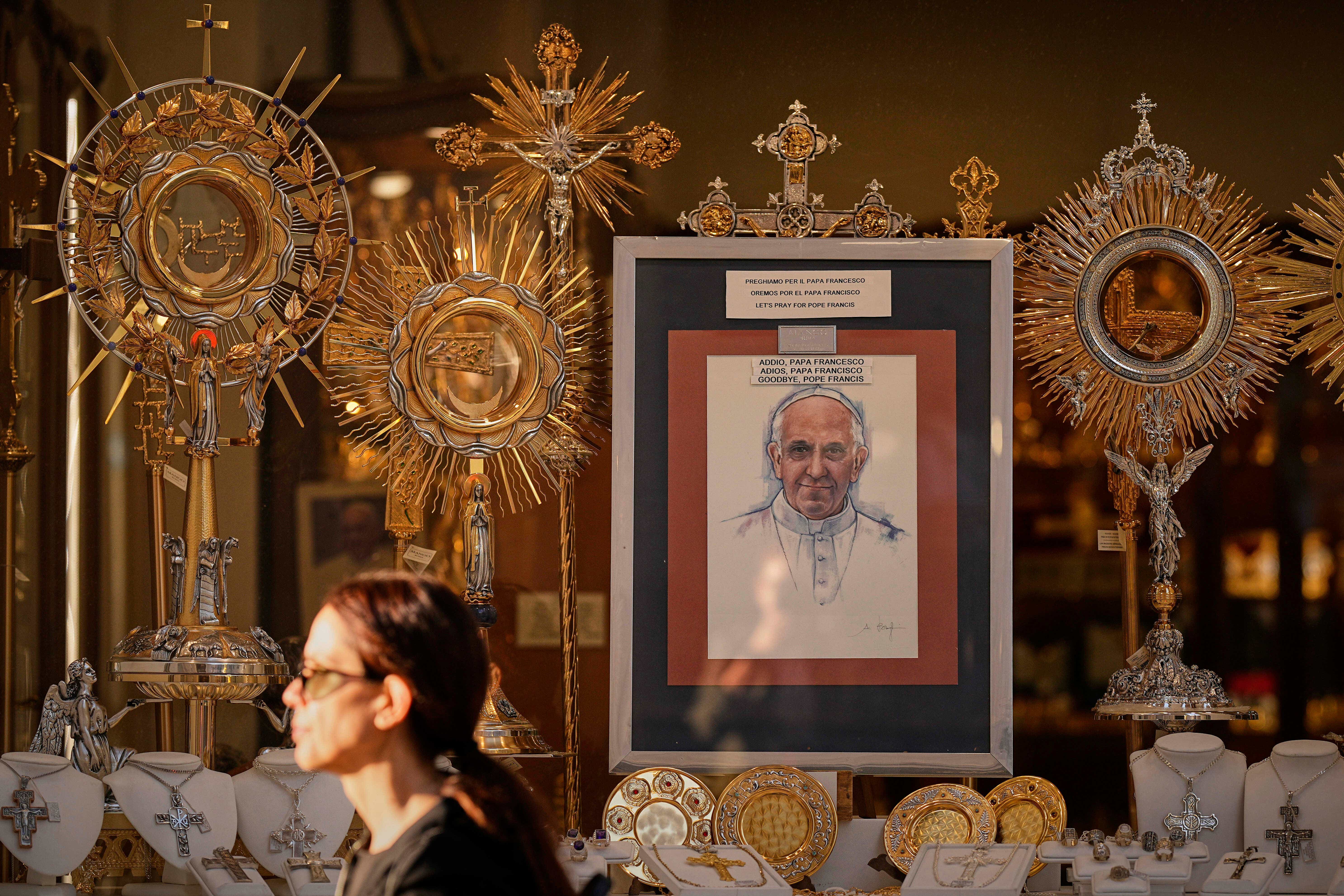 A depiction of the late Pope Francis is placed in a shop window outside the Vatican (Andreea Alexandru/AP)