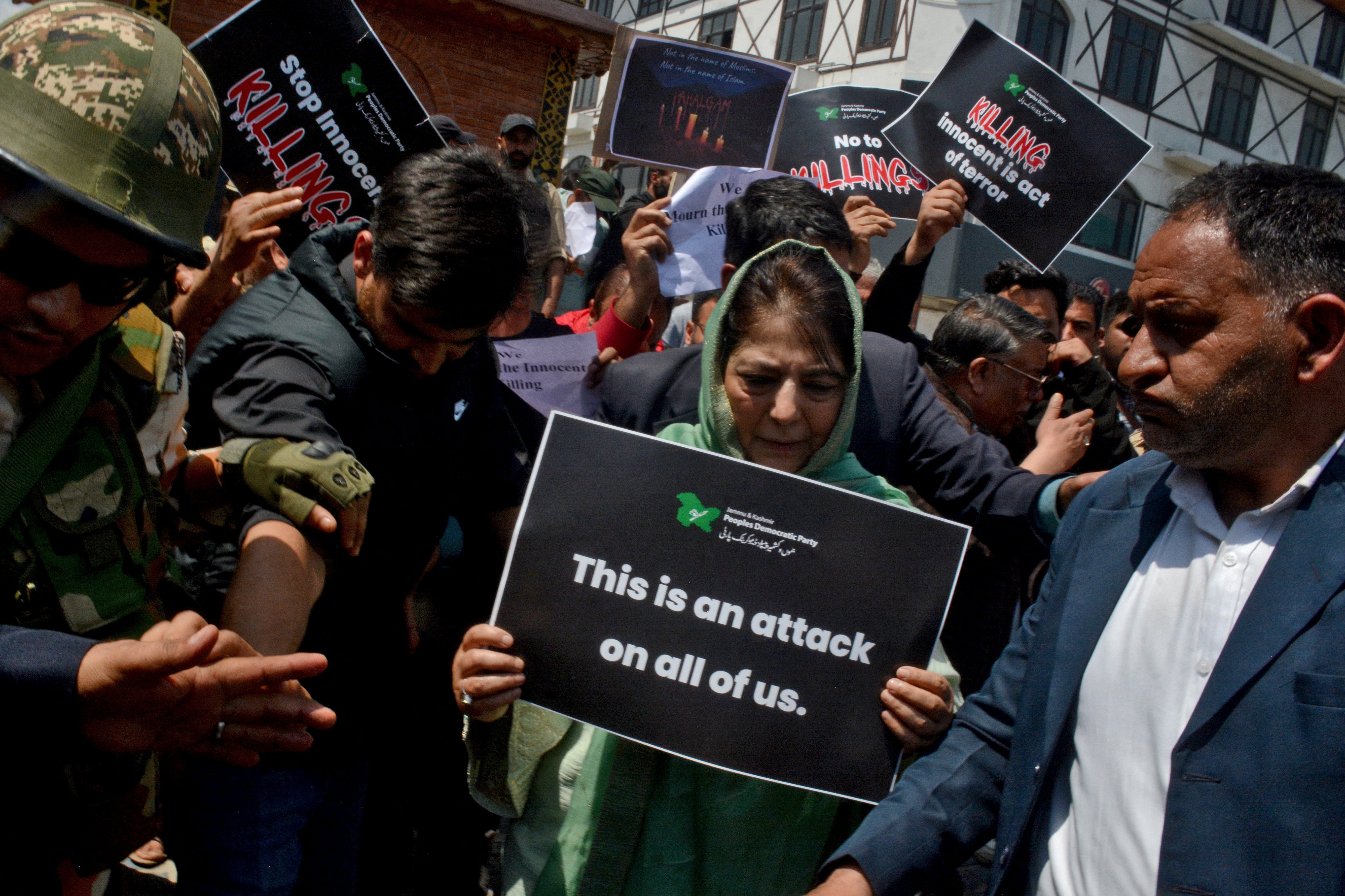 Former chief minister of Jammu and Kashmir Mehbooba Mufti holds a placard during a protest against the Pahalgam attack on 23 April 2025