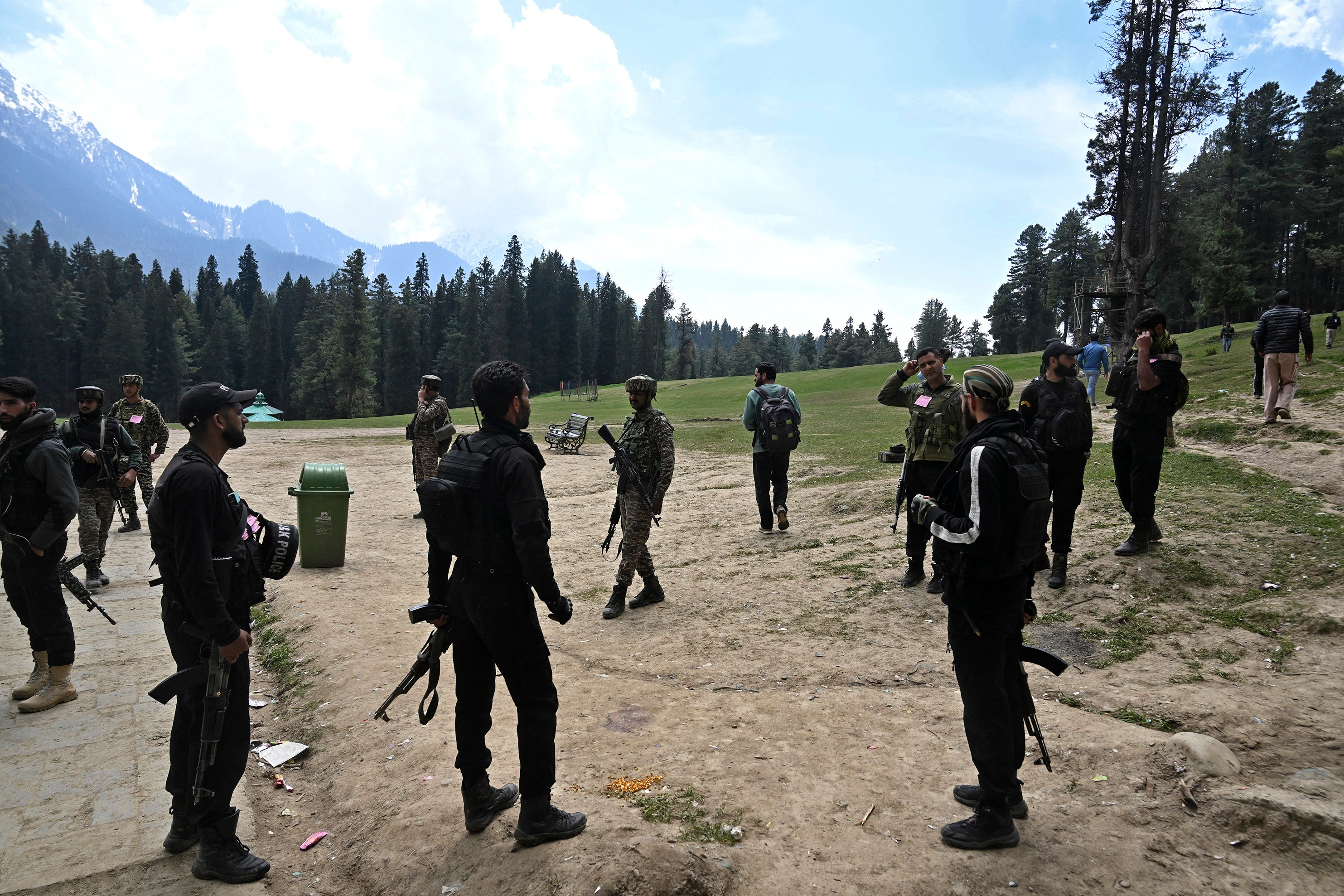 Security personnel inspect the site of the attack in Pahalgam on 23 April 2025