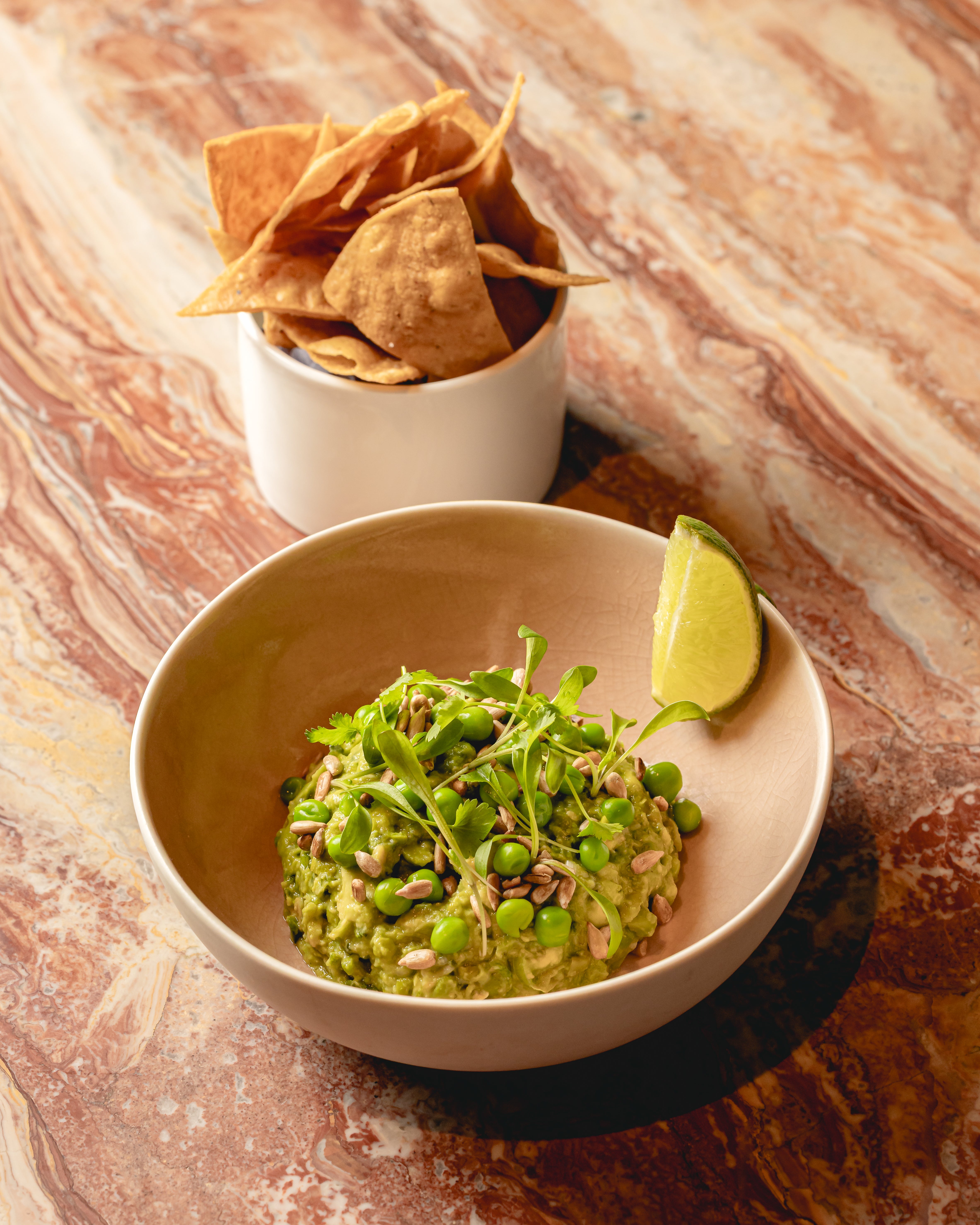 Sweet pea guacamole with charred jalape?o and sunflower seeds – a spring-fresh twist on a classic