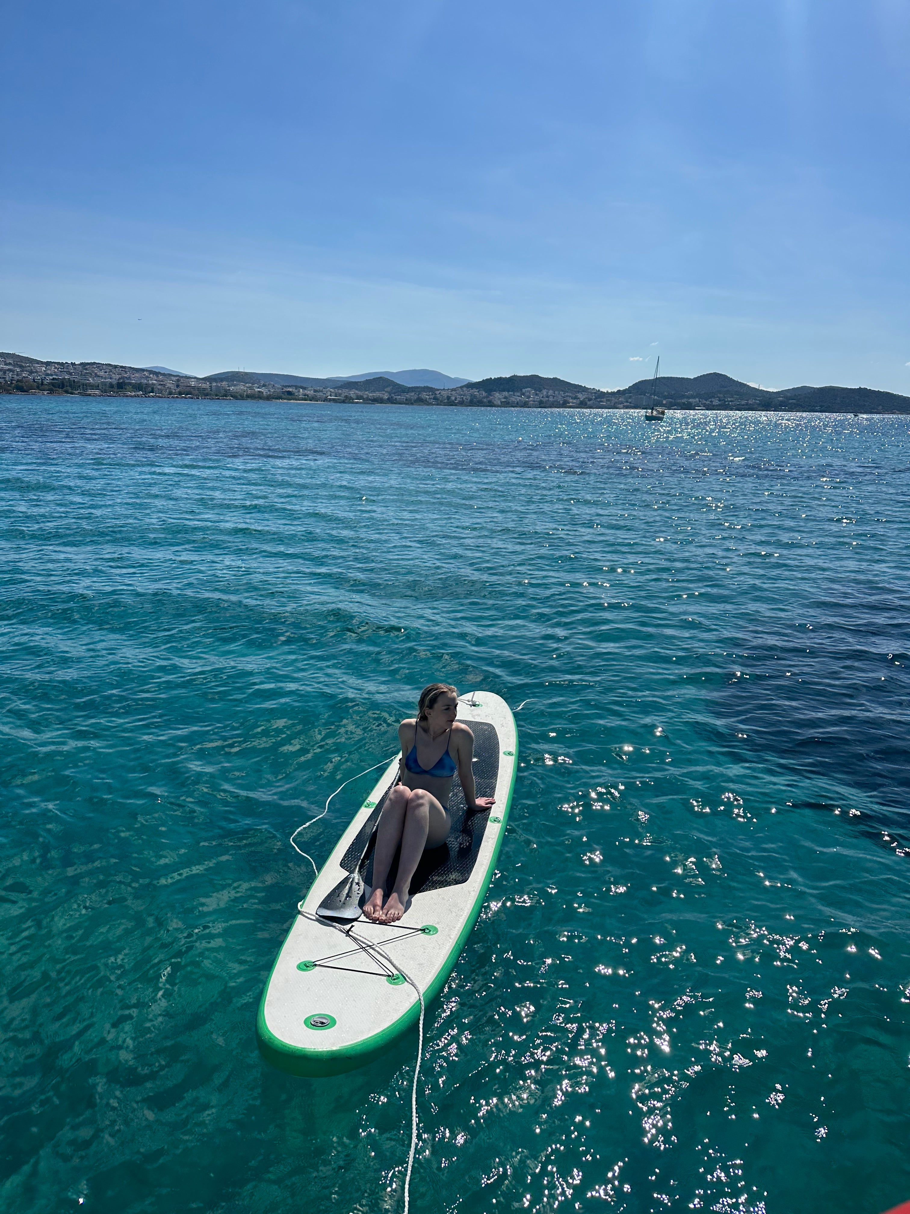 Camilla relaxing on a paddle board during the morning cruise (Camilla Foster/PA)