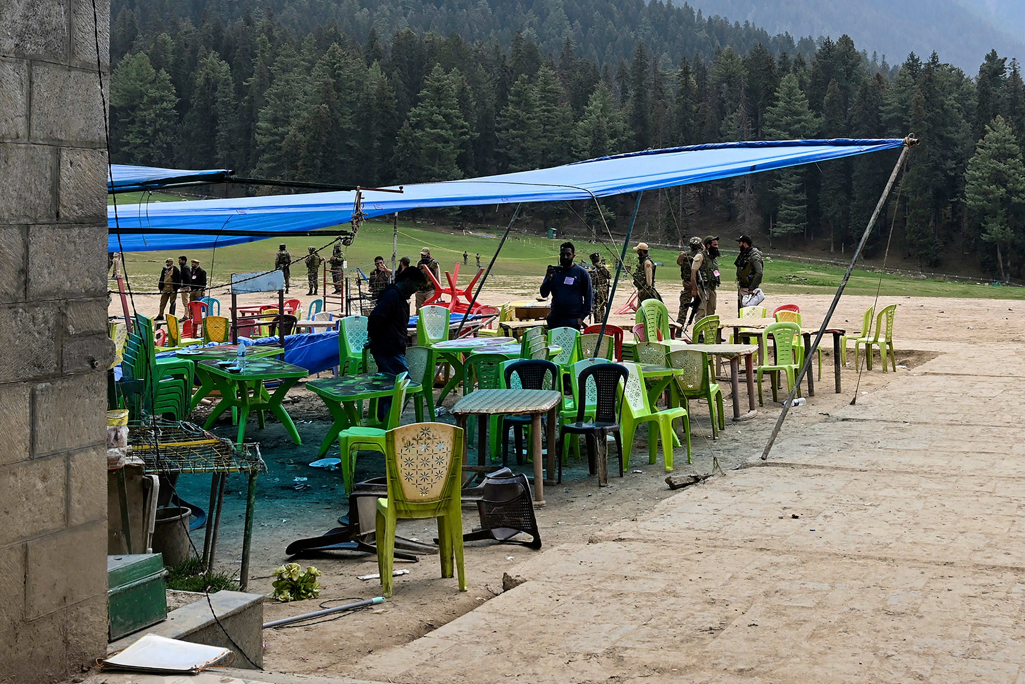 Security personnel inspect the site of the attack in Pahalgam on 23 April 2025