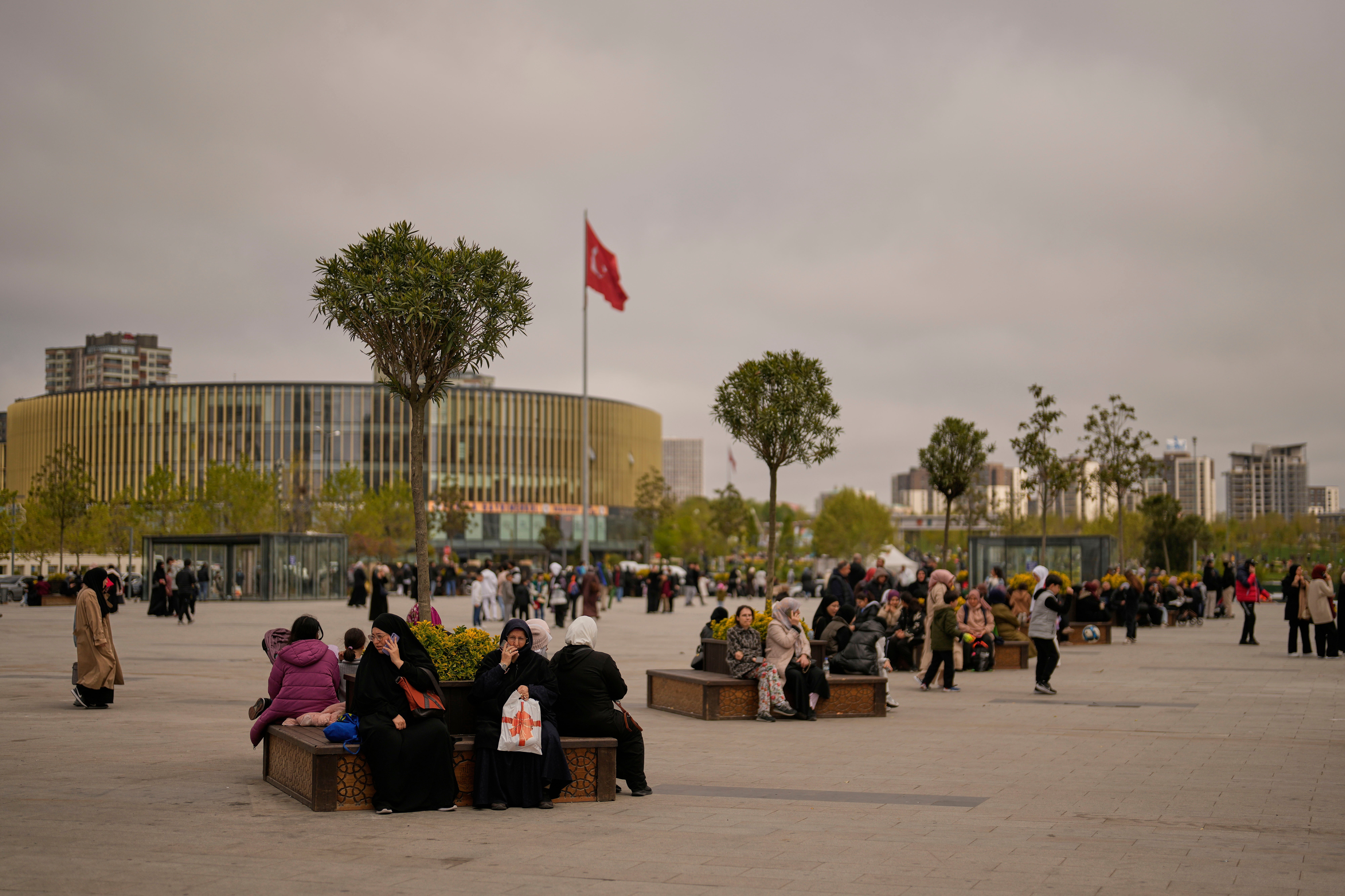 People gather outdoors after a quake in Istanbul