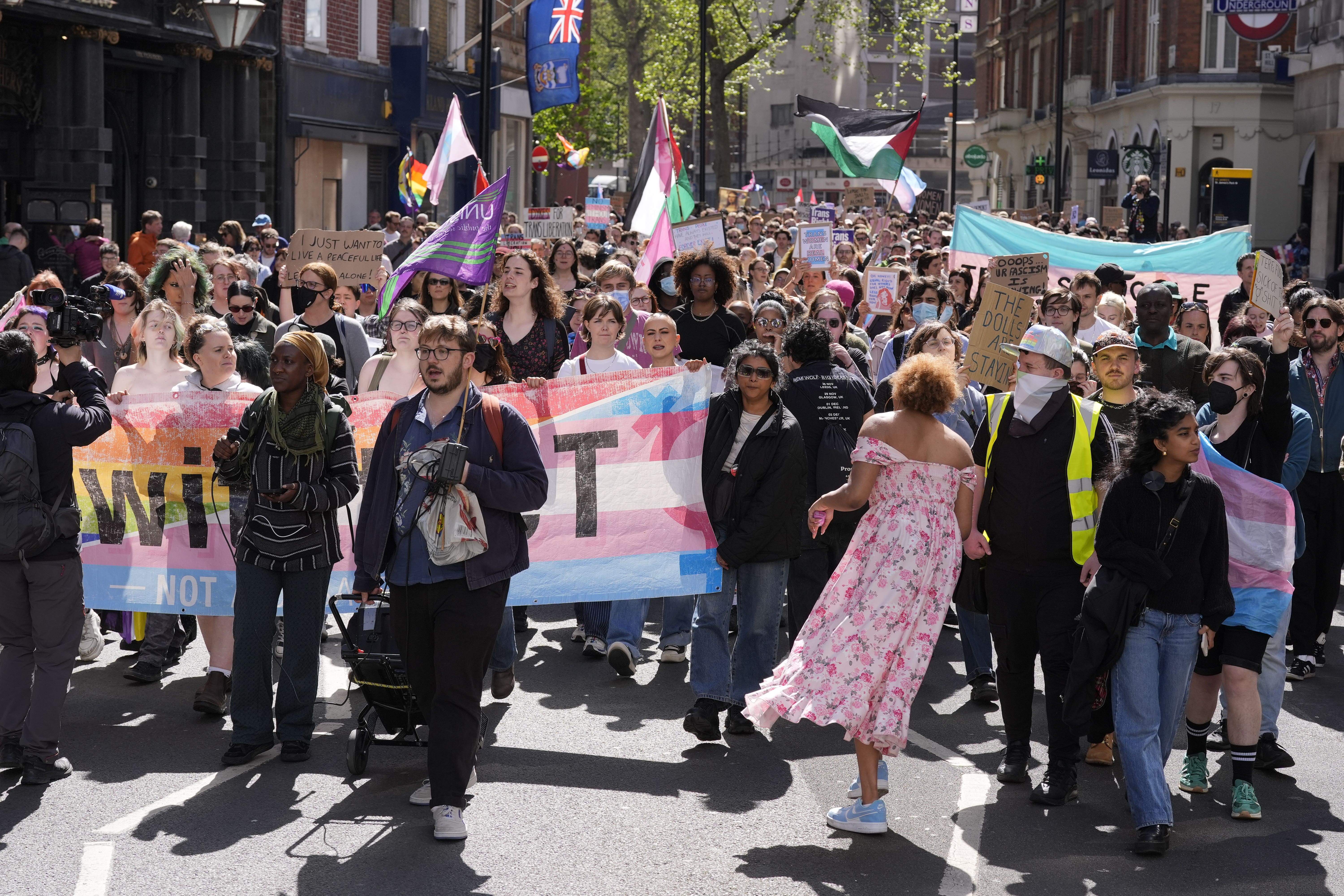 Campaigners march along Broadway, after a rally organised by trangenders rights groups, trade unions and community organisations at Parliament Square, central London, on Saturday (Andrew Matthews/PA)