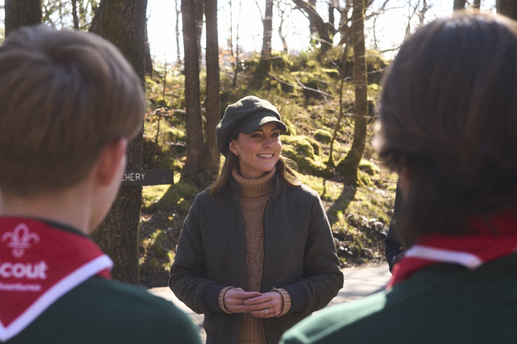 The Princess of Wales wearing a baker boy hat in the woodland of the Lake District