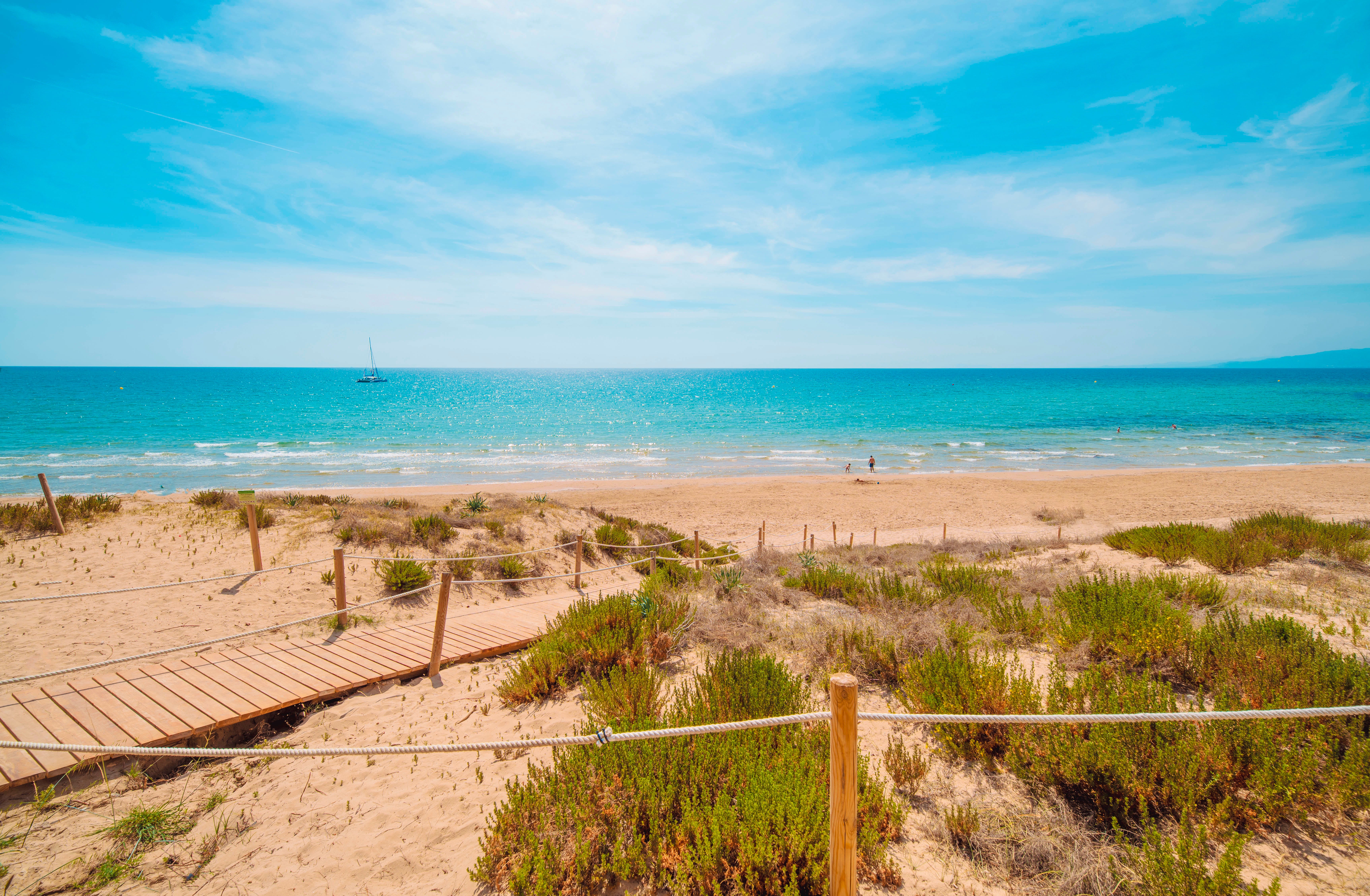Boasting postcard-perfect dunes and turquoise waters, Platja Llarga makes for a truly idyllic esacpe