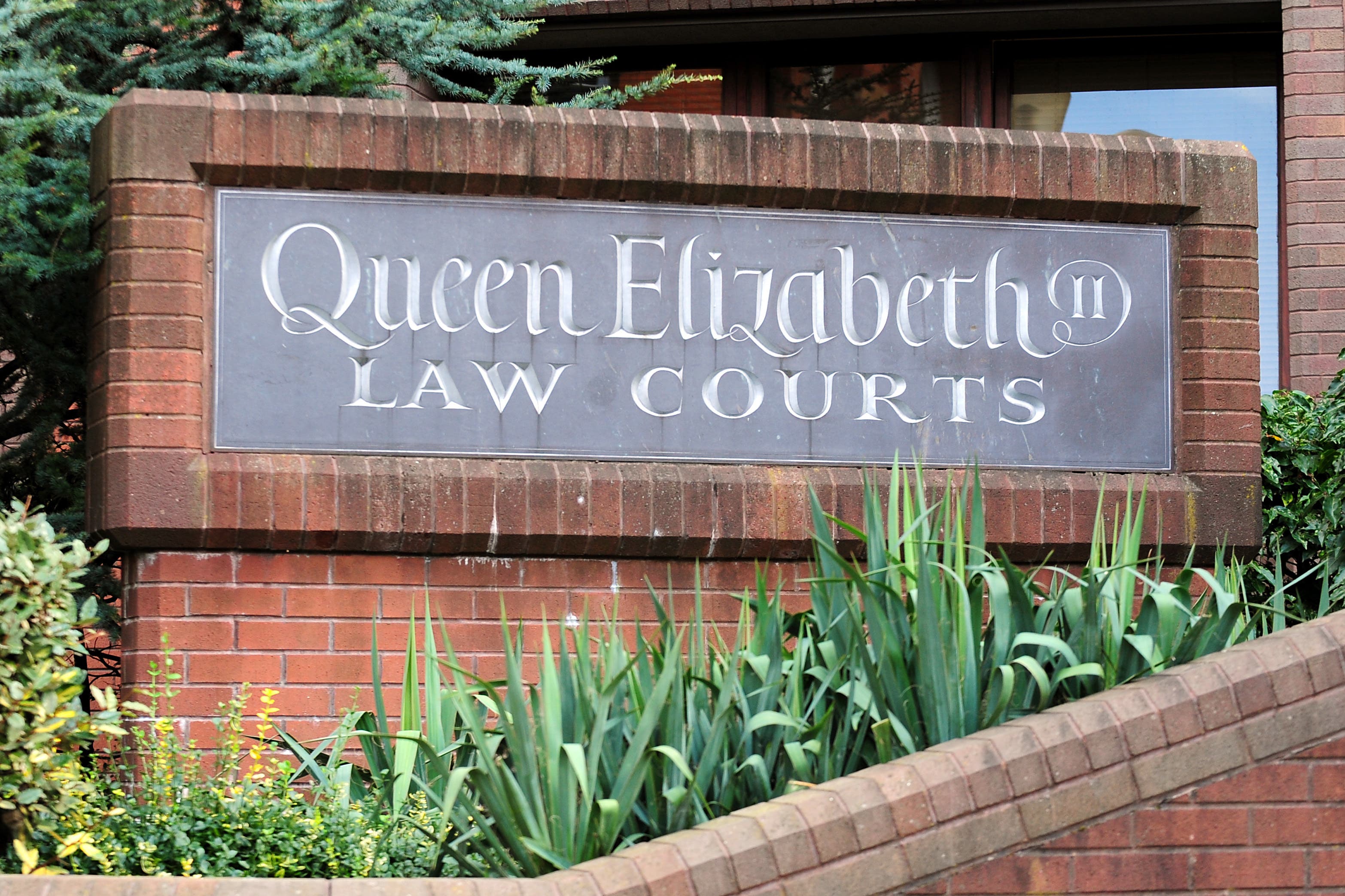 The trial is taking place at Birmingham Crown Court (PA)