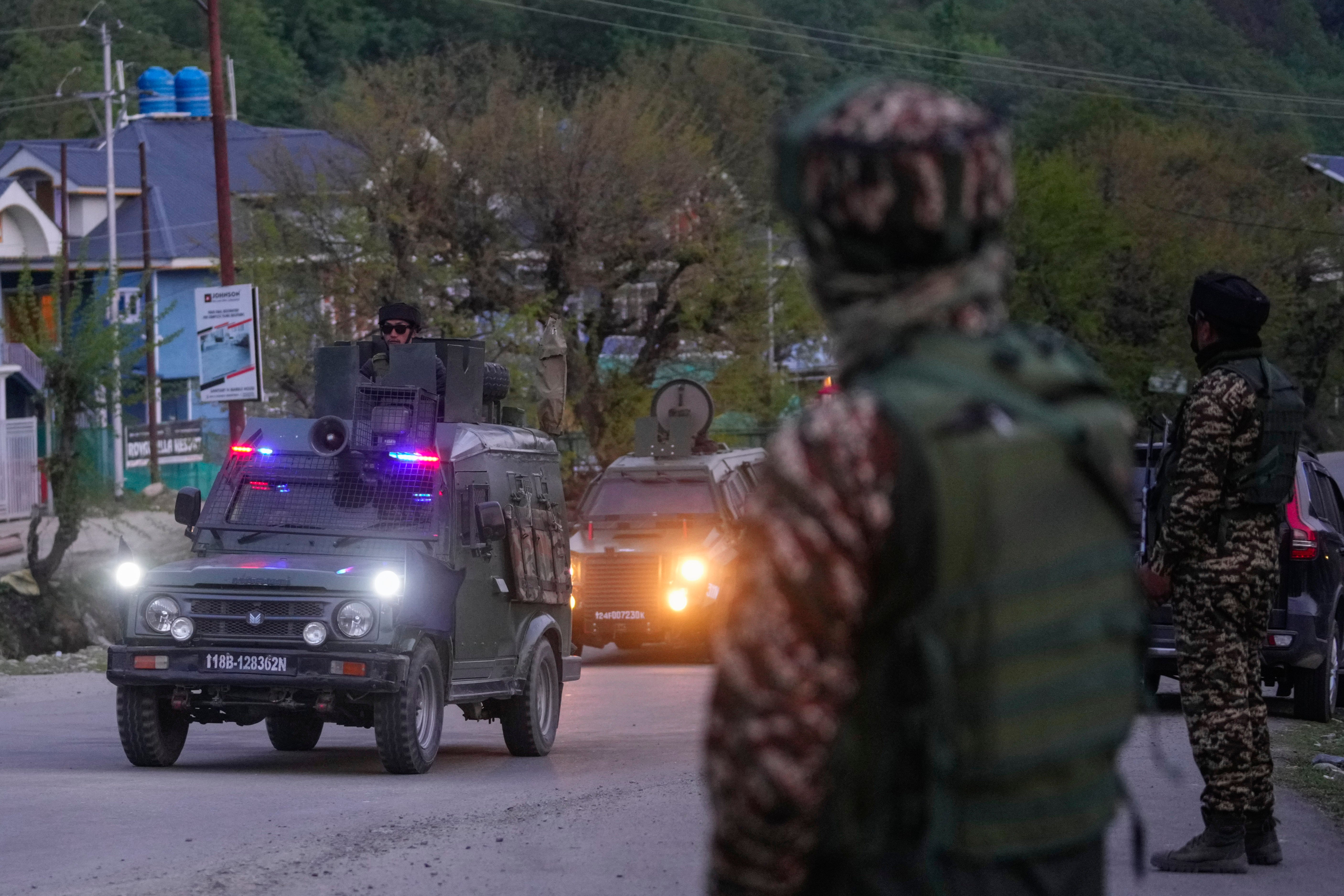Indian security officers patrol near Pahalgam in south Kashmir after assailants indiscriminately opened fire on tourists