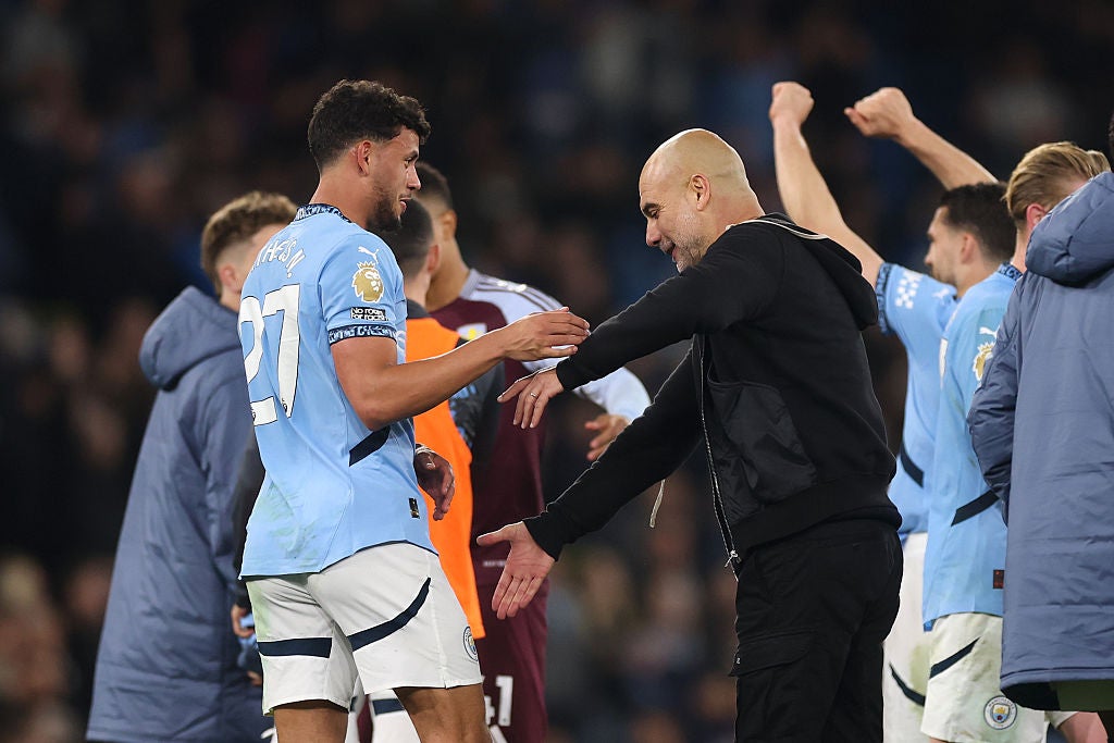 Guardiola celebrates with Nunes at full-time