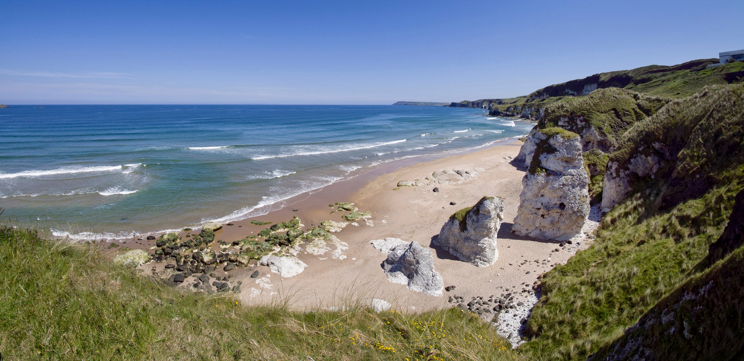 <p>Escape the crowds at White Rocks beach near Portrush in Northern Ireland this summer</p>