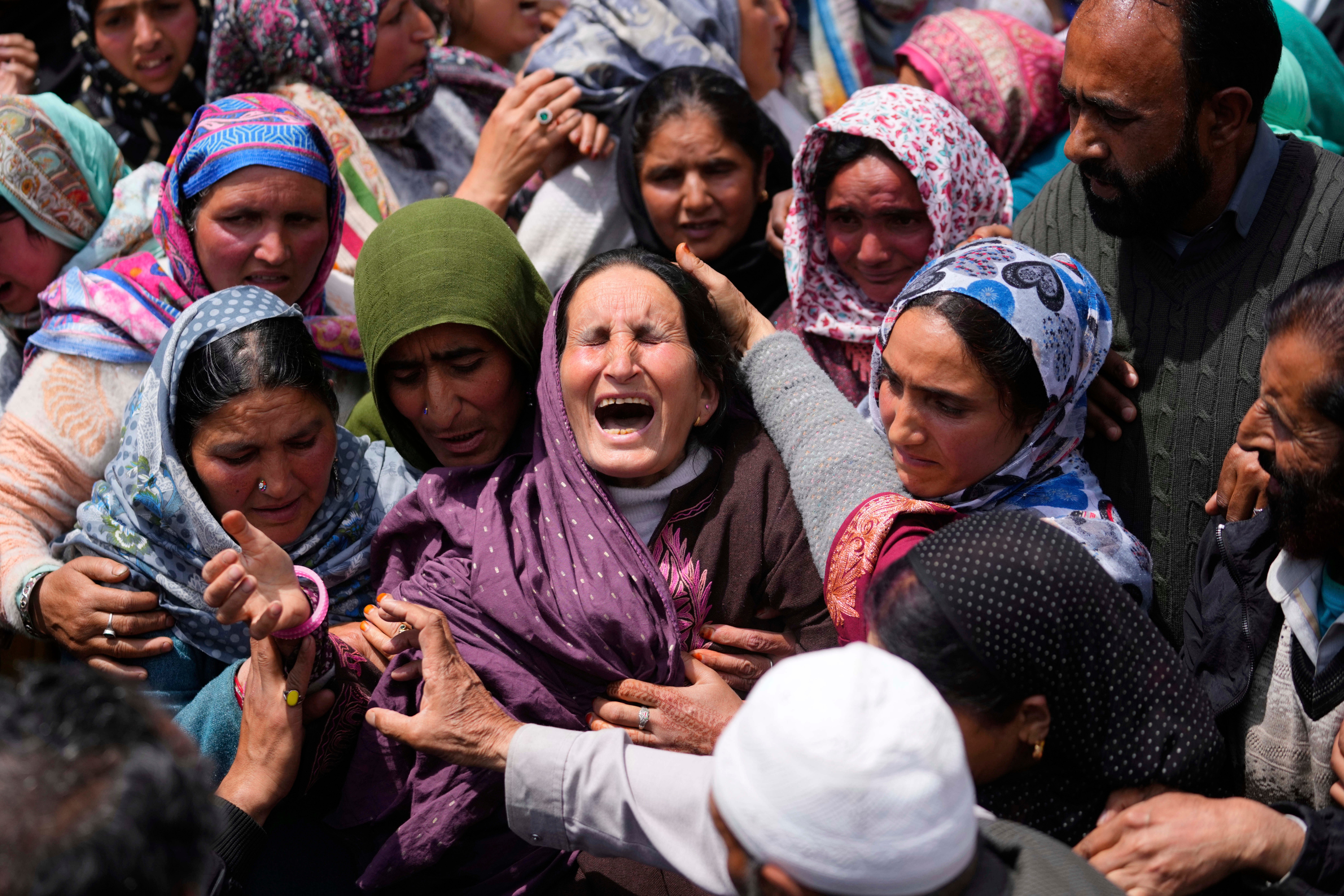 Relatives wail during the funeral procession of Adil Hussain Shah, a local Kashmiri man who was killed when gunmen fired on a crowd of tourists in Pahalgam