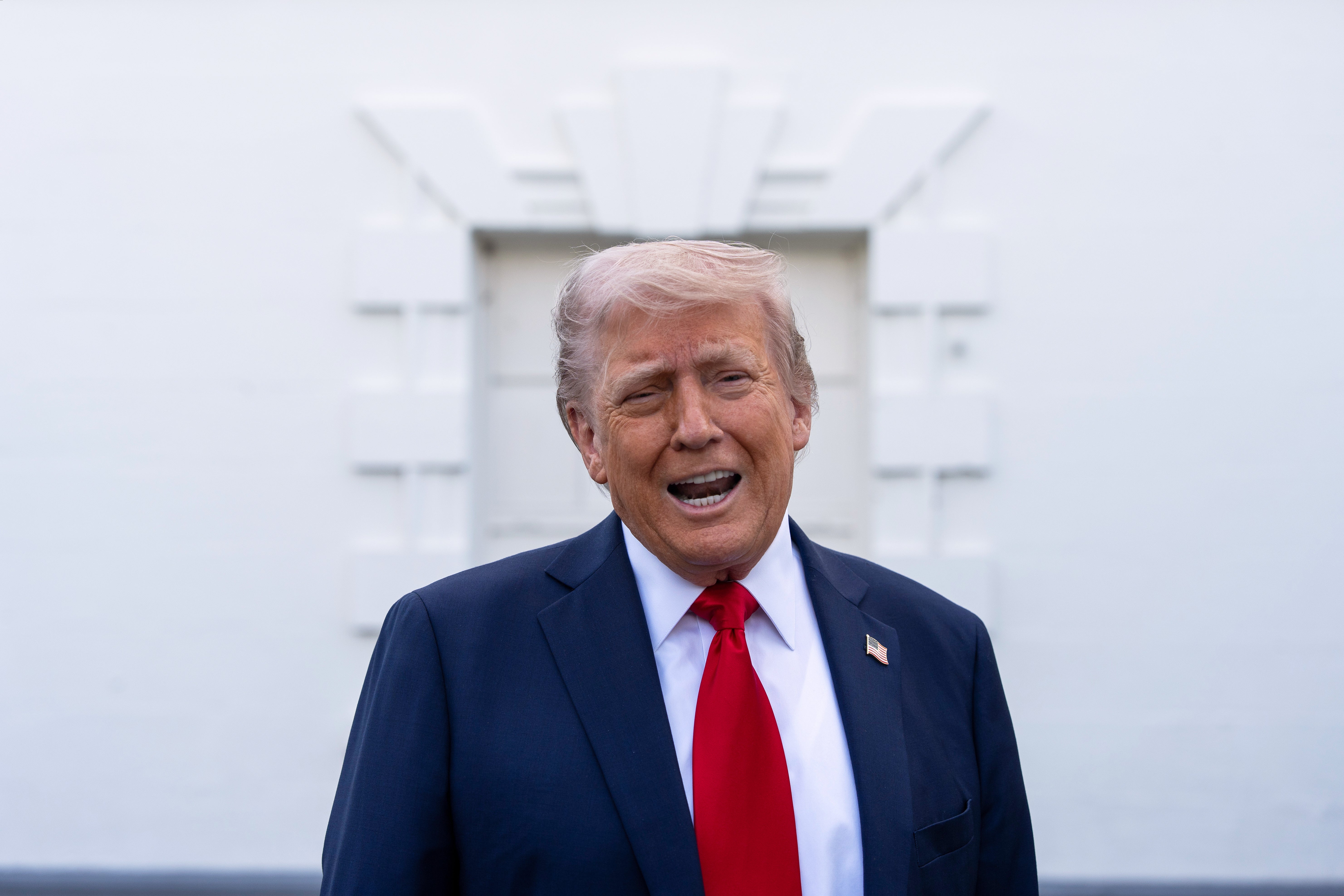 Donald Trump speaks to reporters at the White House as he continues a trade dispute with numerous foreign countries and implements a mass deportation program