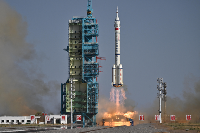 <p>A Long March-2F carrier rocket, carrying the Shenzhou-20 spacecraft and a crew of three astronauts, lifts off from the Jiuquan Satellite Launch Centre in the Gobi desert, in northwest China</p>