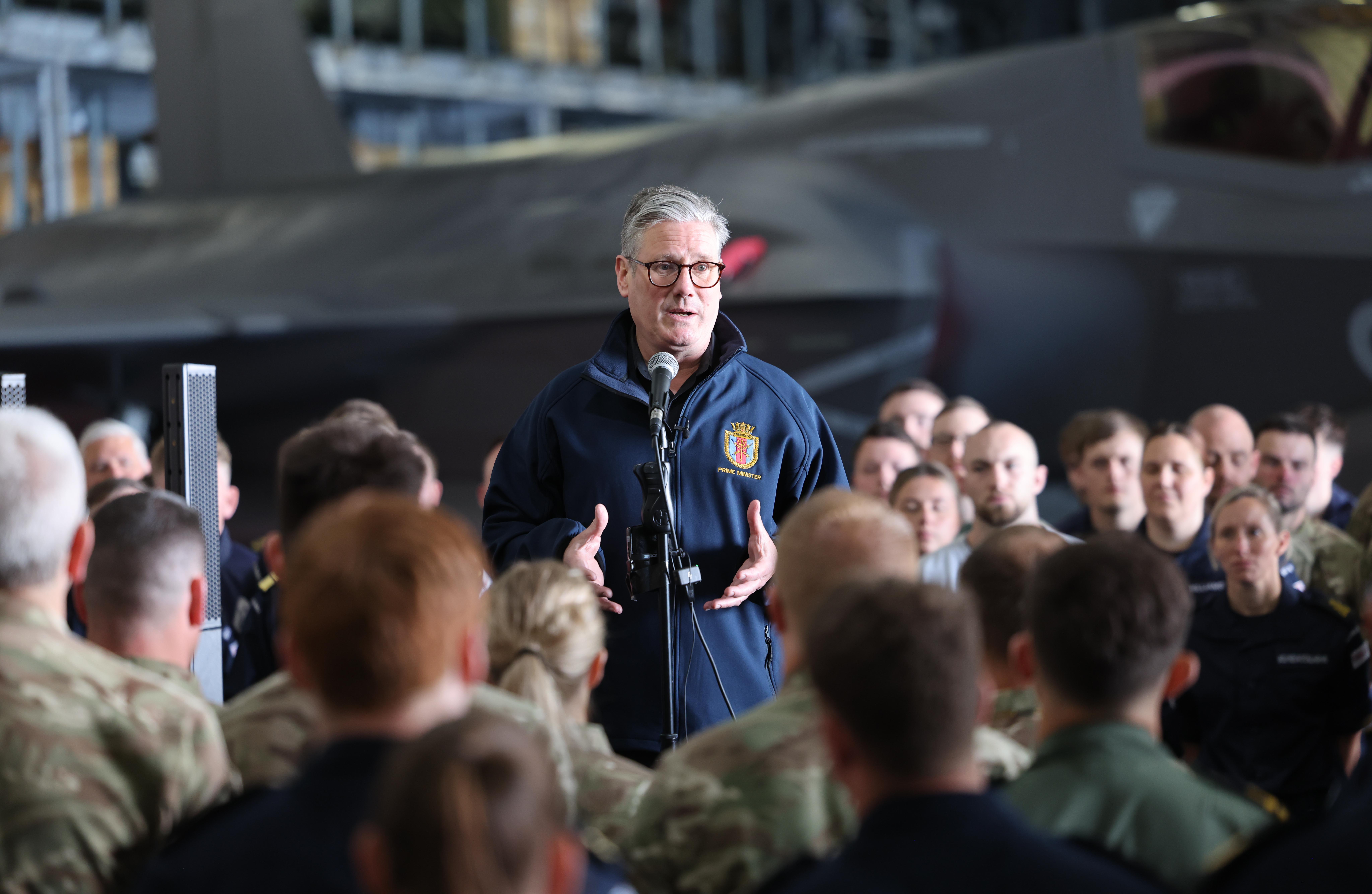 Keir Starmer in front of one of the UK’s aircraft carriers
