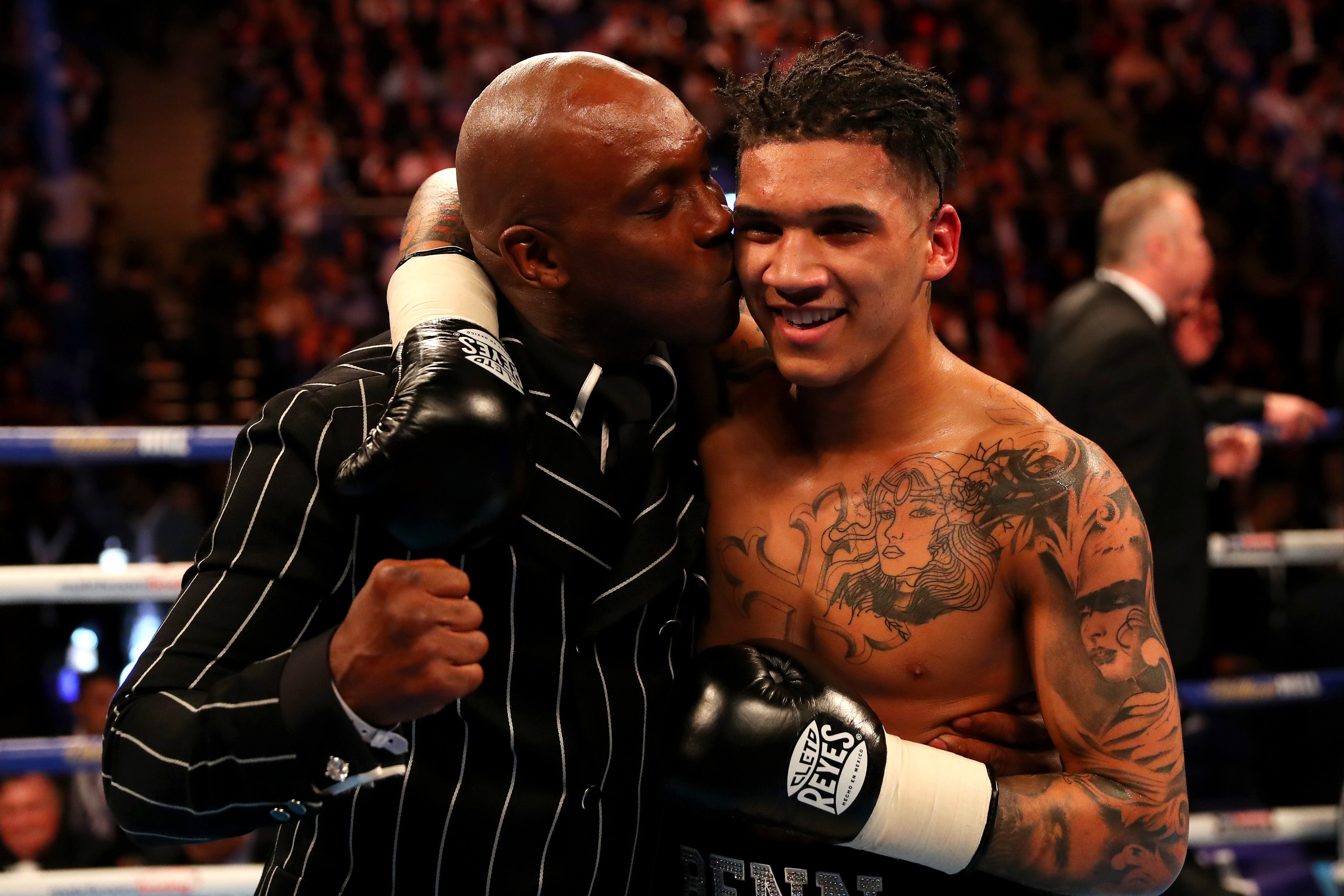 Benn celebrates with his son Conor after he defeated Ivailo Boyanov at the O2 Arena in April 2016