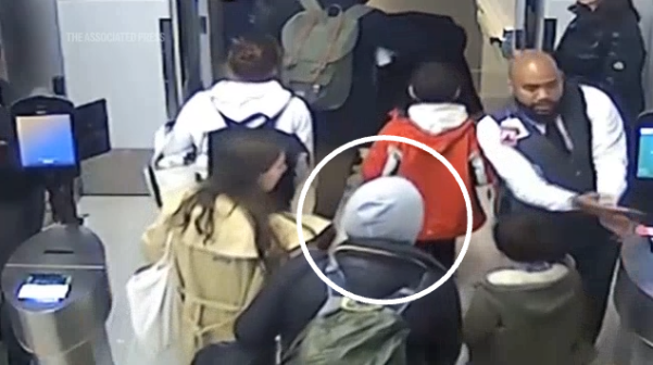 She can be seen among a group of passengers boarding the flight