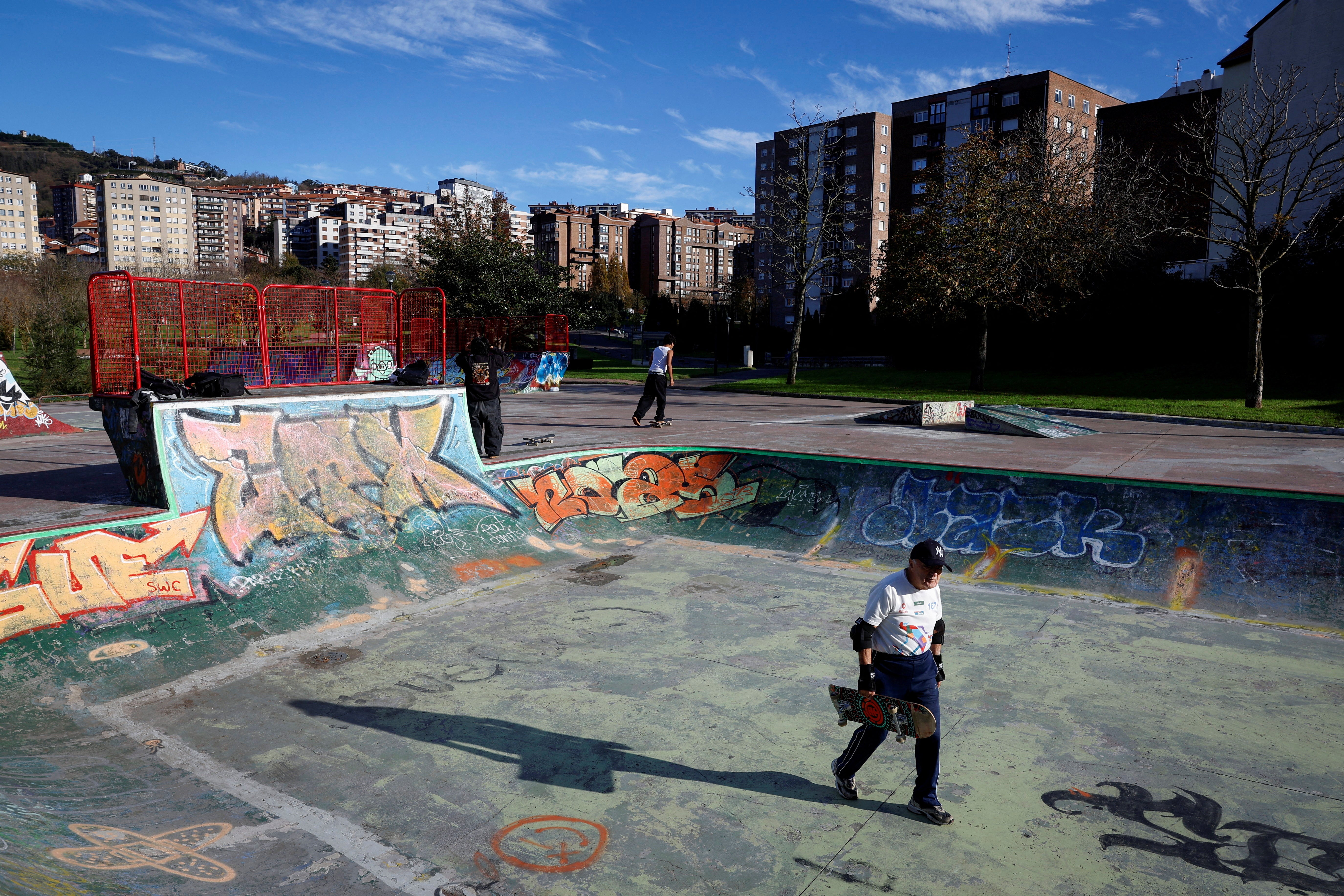 Juanjo Albizu carries his board in a bowl at the Etxebarria Skatepark
