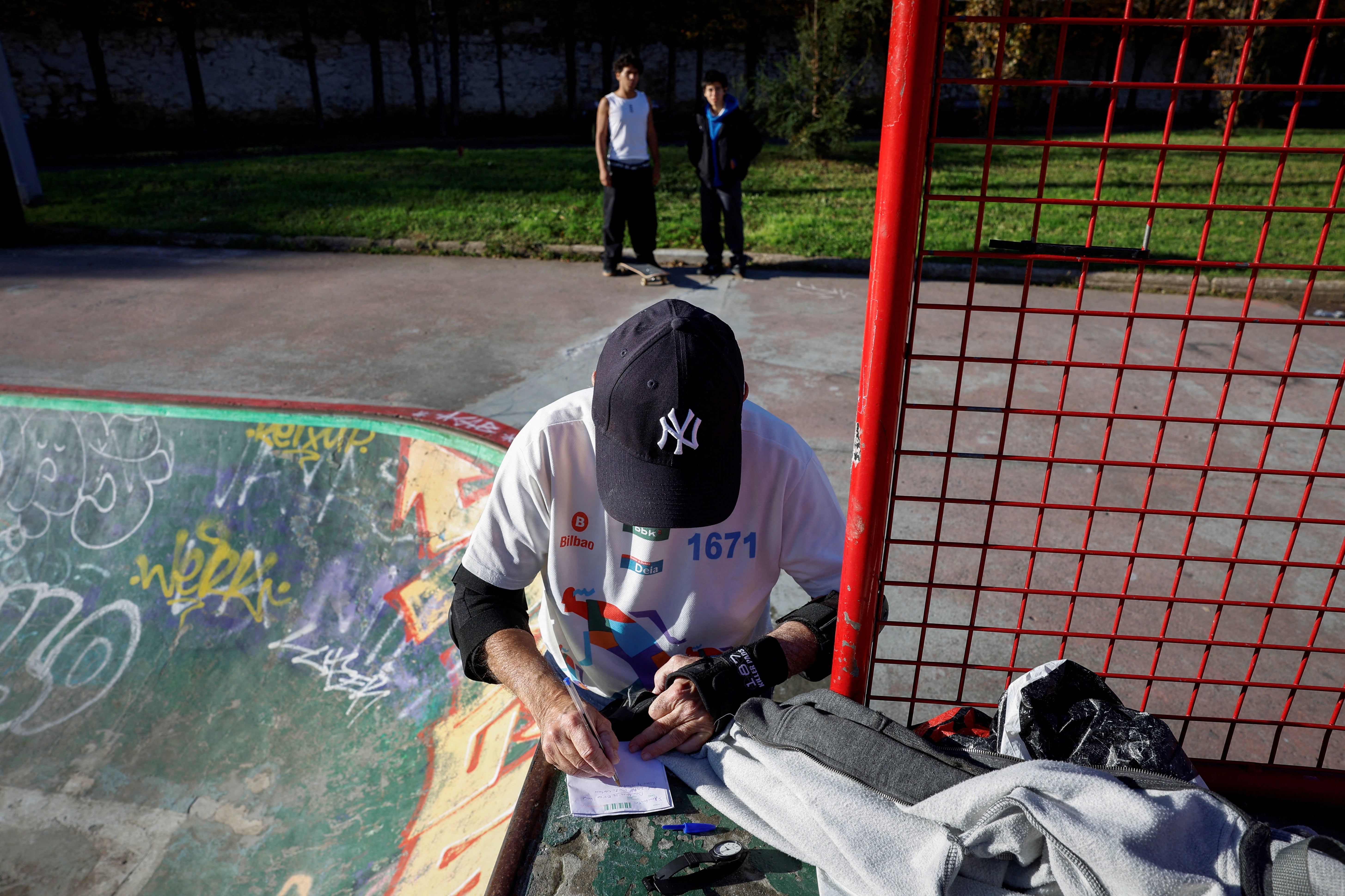 Albizu takes training session notes next to a bowl at the Etxebarria Skatepark