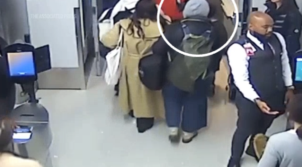 She appears to walk straight past staff and manages to get on the trip to Paris
