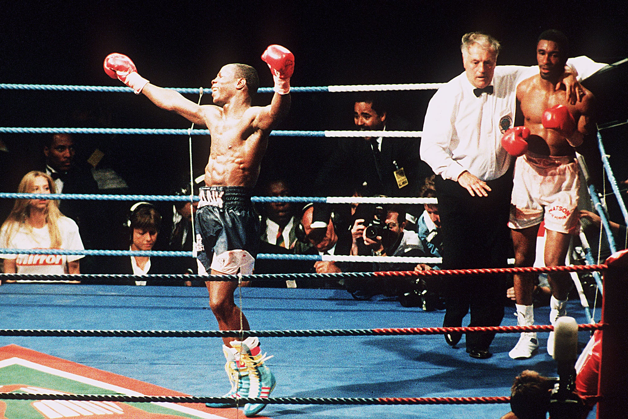 Chris Eubank celebrates his victory against Michael Watson (right) in their second WBO Middleweight title fight