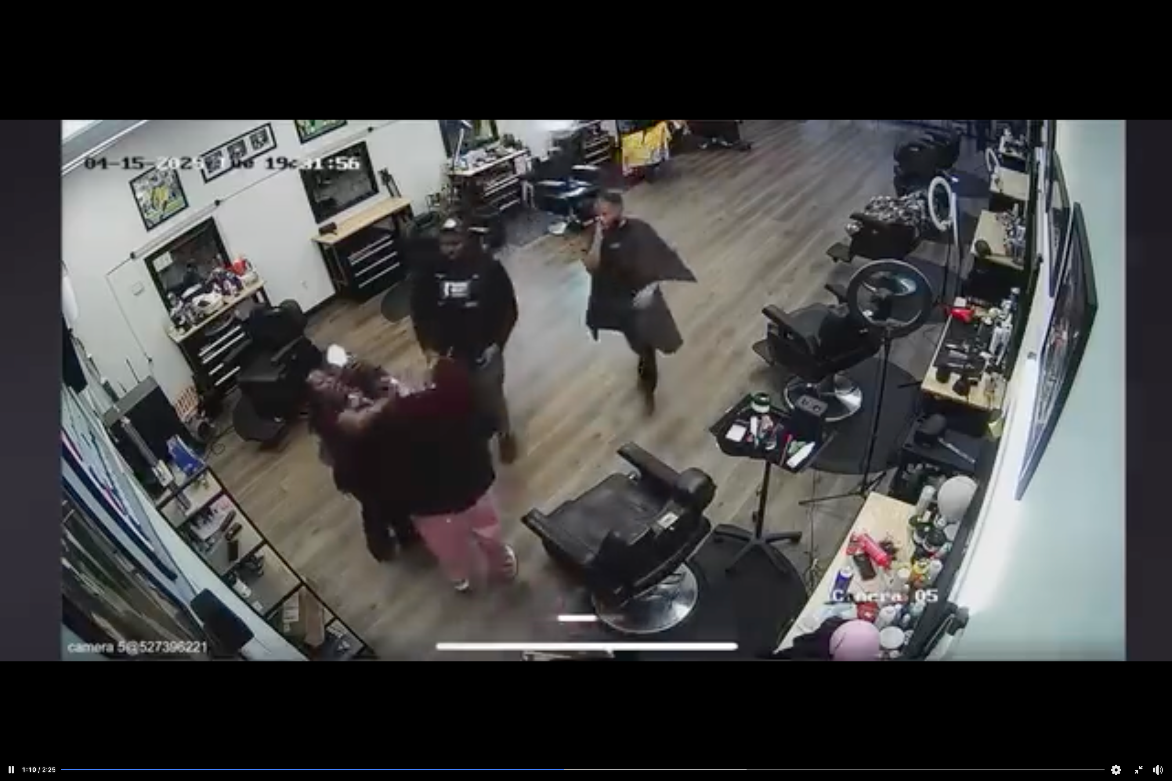 A male hairdresser and his client try to intervene