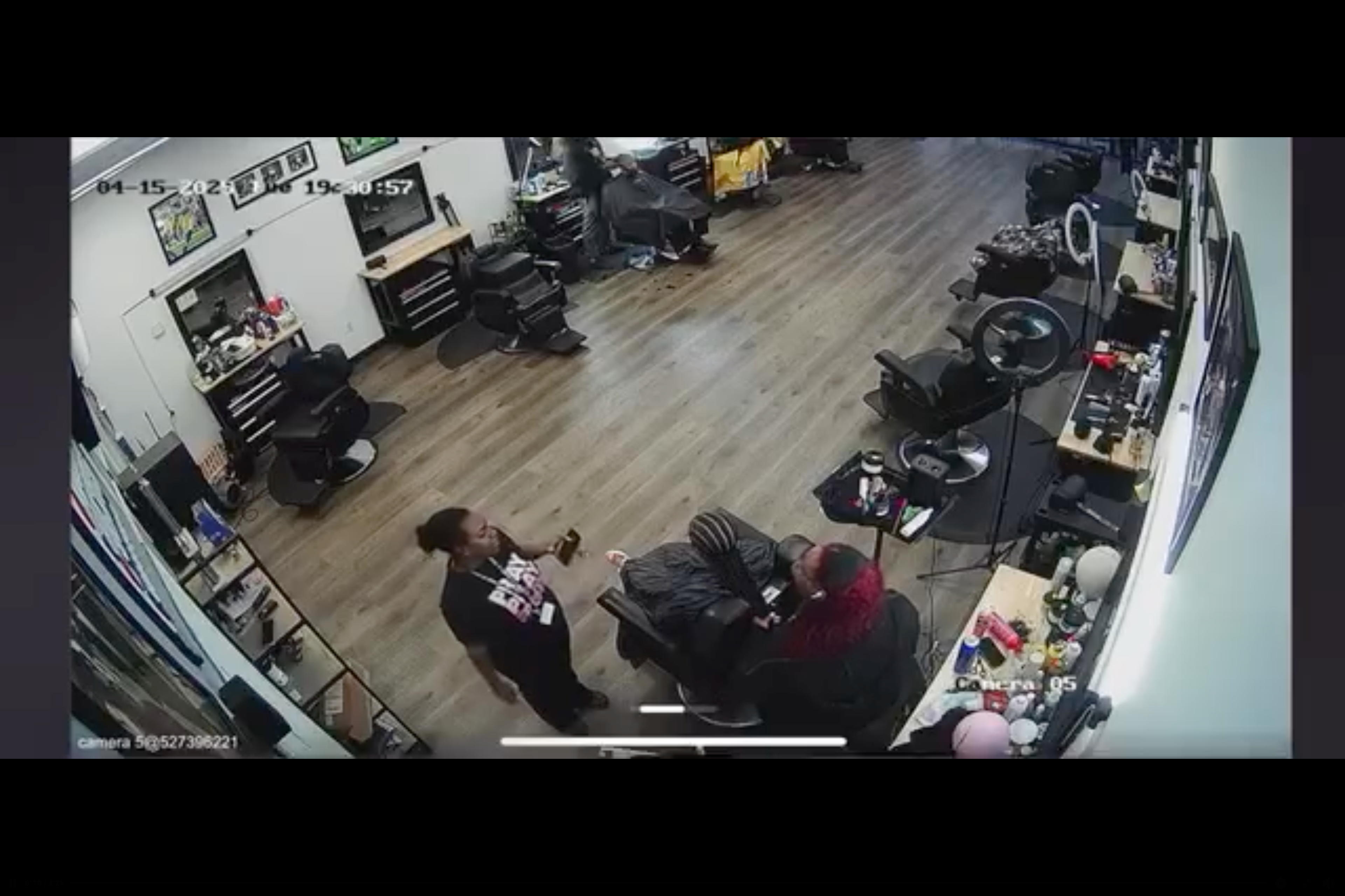 The two adults appear to begin arguing in the clip