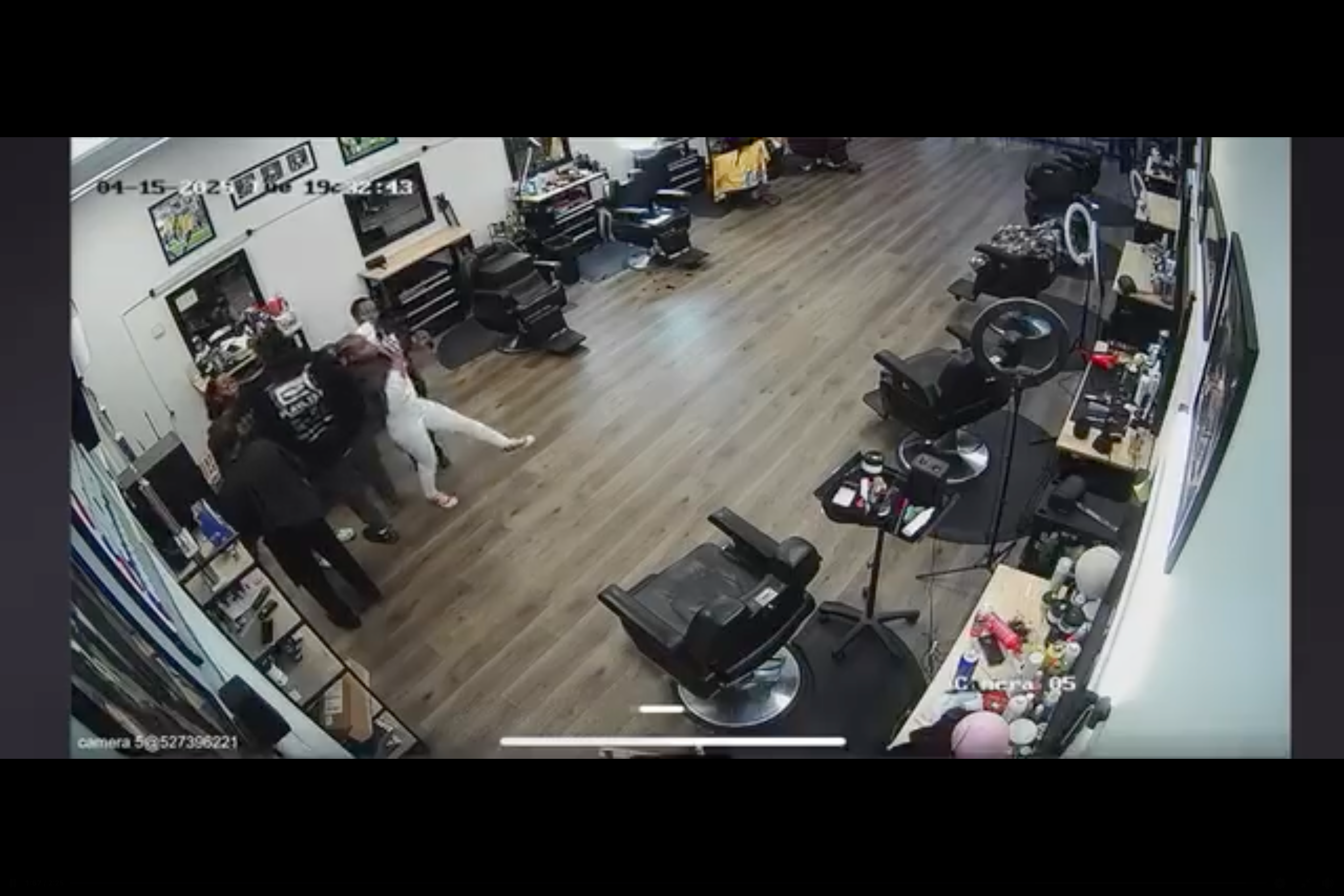 Being pulled back by her braids, the 11-year-old is set off balance