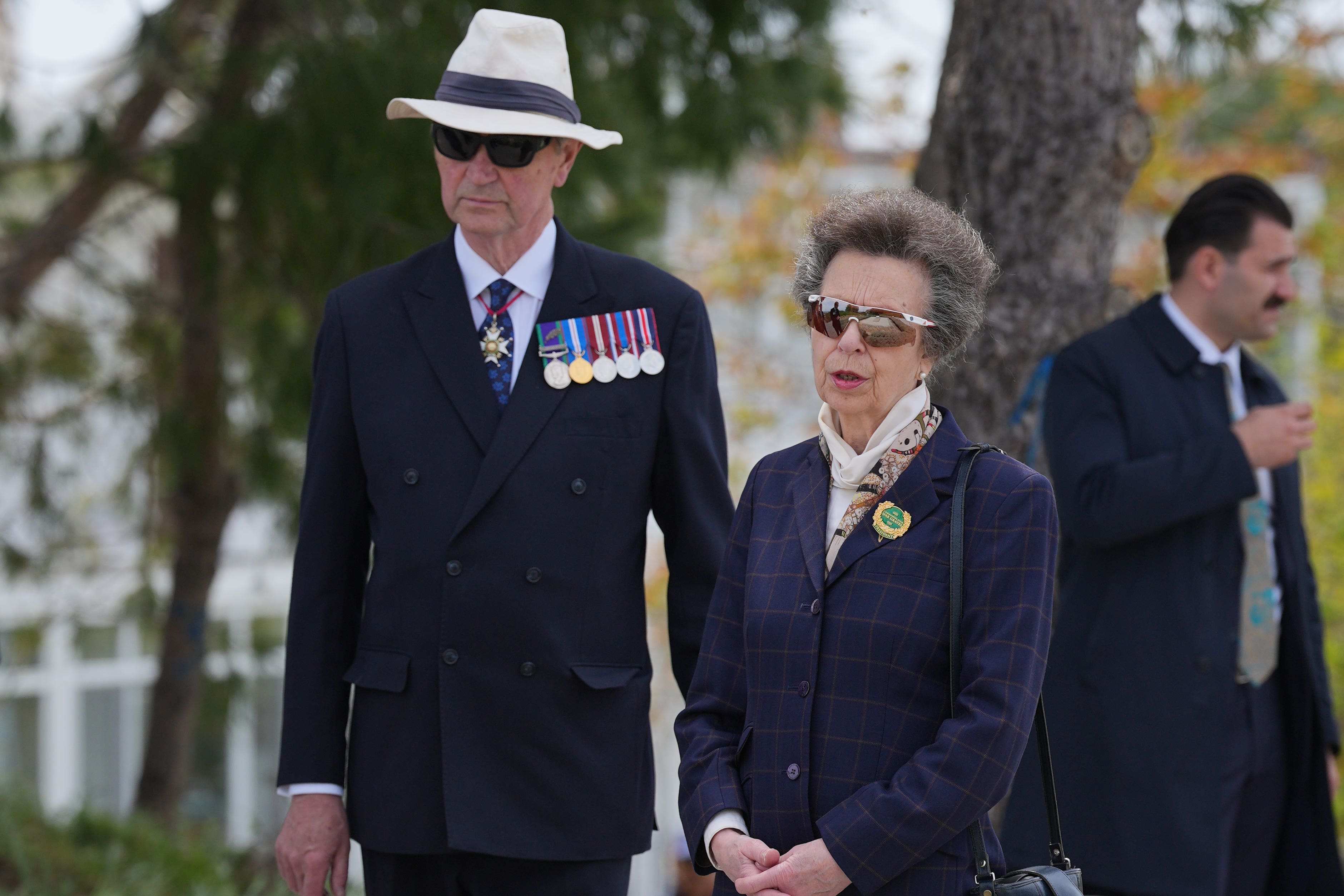 The Princess Royal, president of the Commonwealth War Graves Commission, and Vice Admiral Sir Tim Laurence at the grave in Sedd el Bahr of Lieutenant Colonel Charles Doughty-Wylie VC of the Royal Welch Fusiliers (Yui Mok/PA)