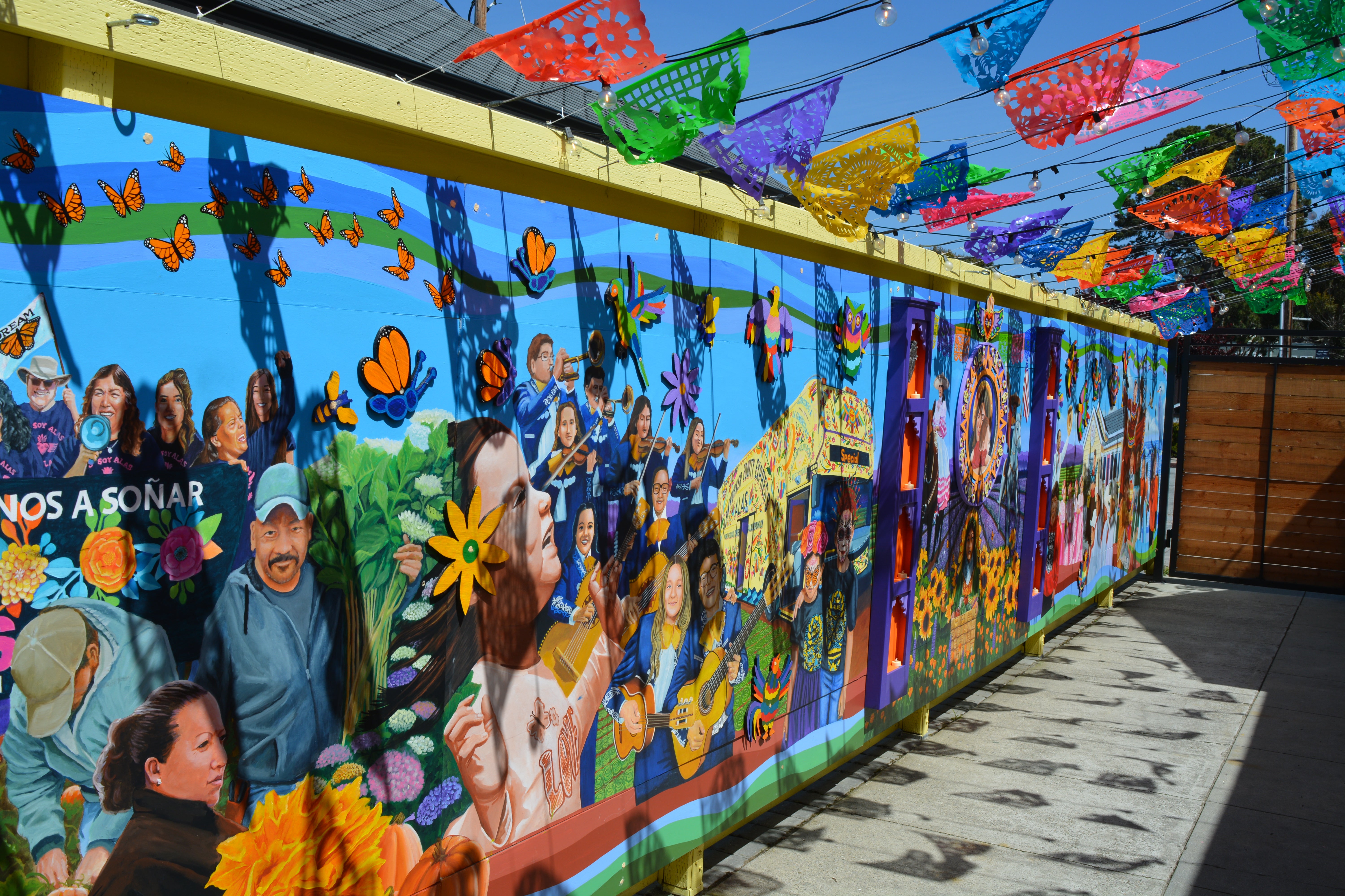 The headquarters of the Ayudando Latinos a Soñar organization in Half Moon Bay, which supports farm workers and offers services like a food pantry, has had to hire security after an increase in anti-immigrant sentiment