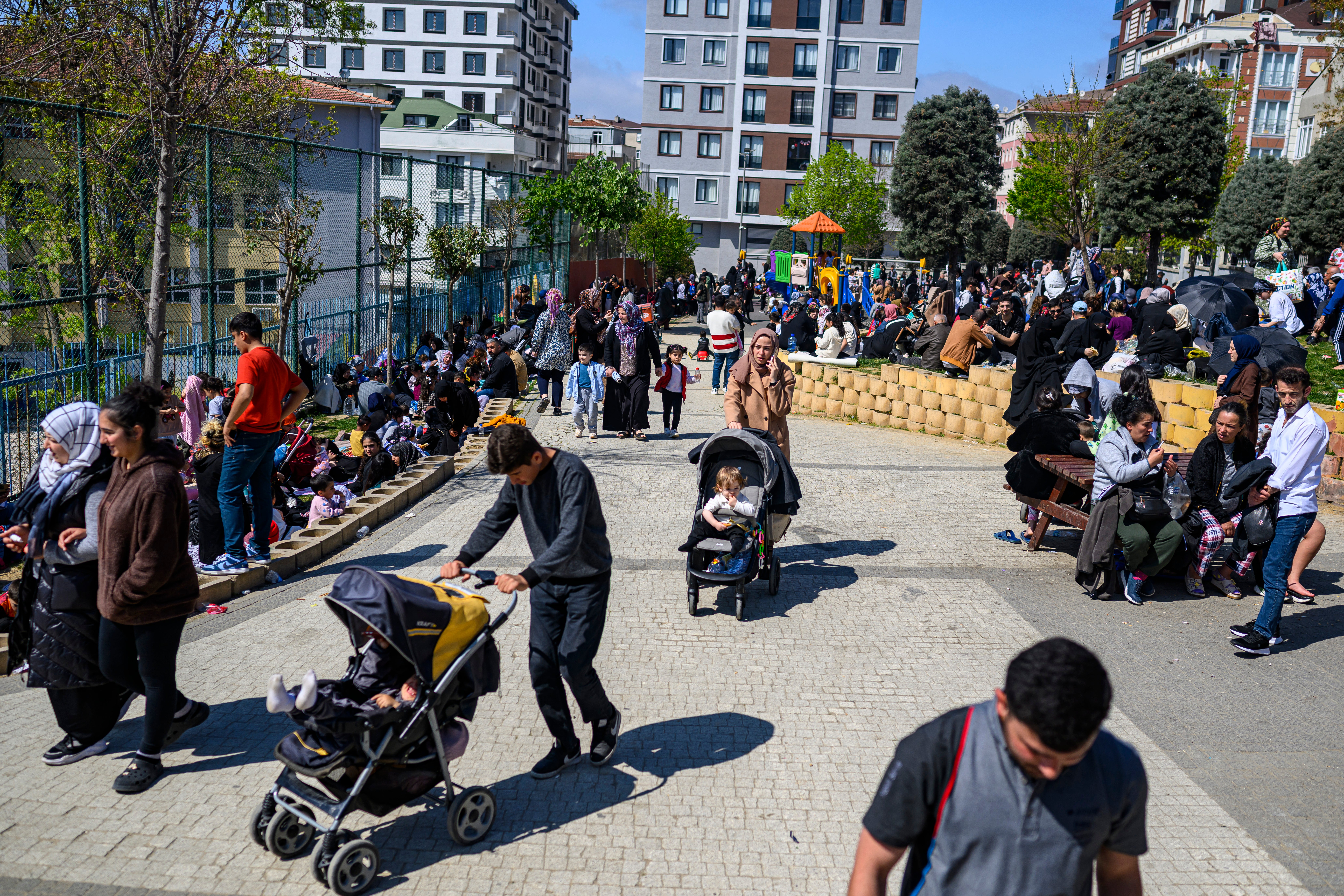 Local residents wait in a park in Istanbul on April 23, 2025, following an initial quake