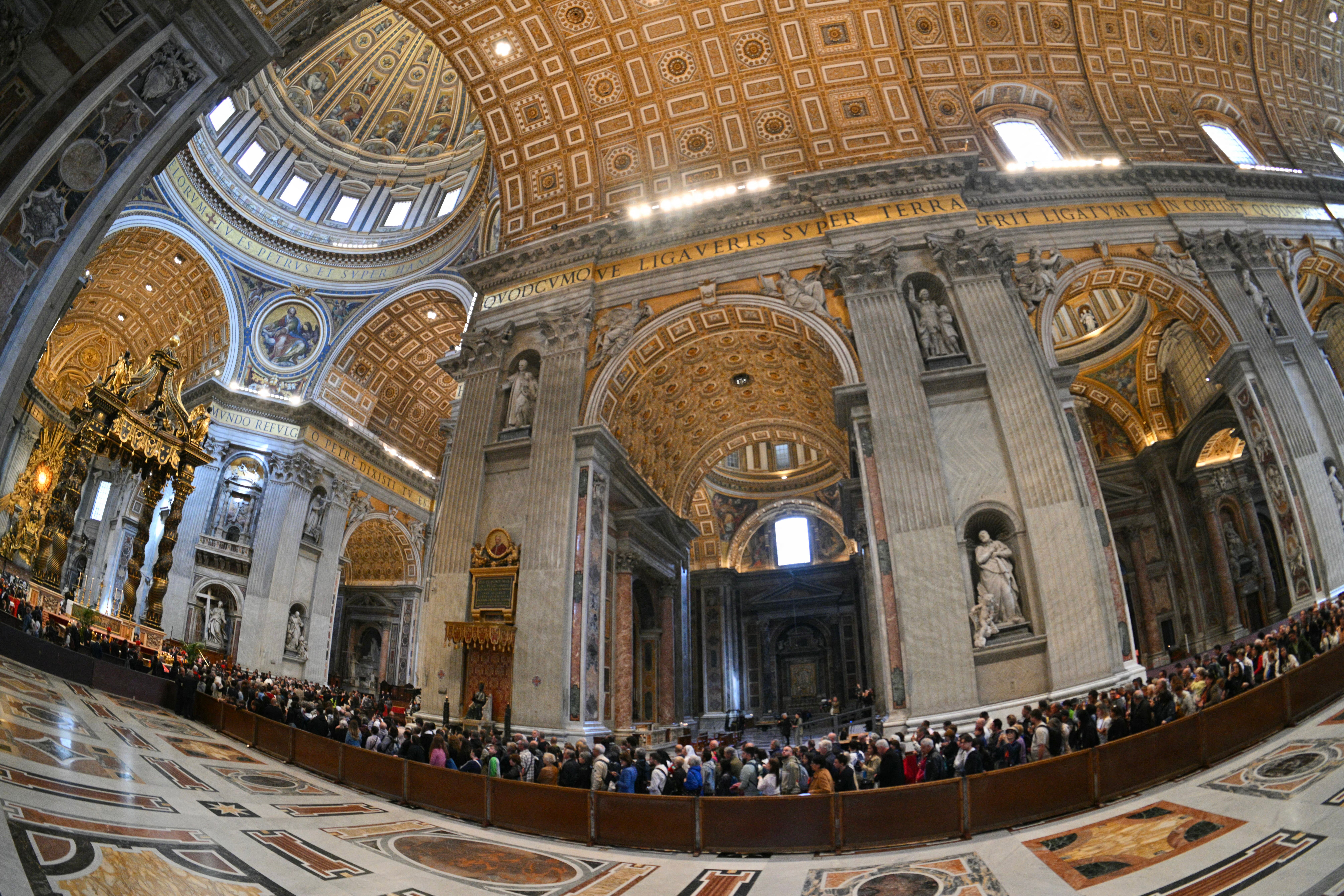 Visitors queue to pay their respects to the late Pope Francis at the Vatican