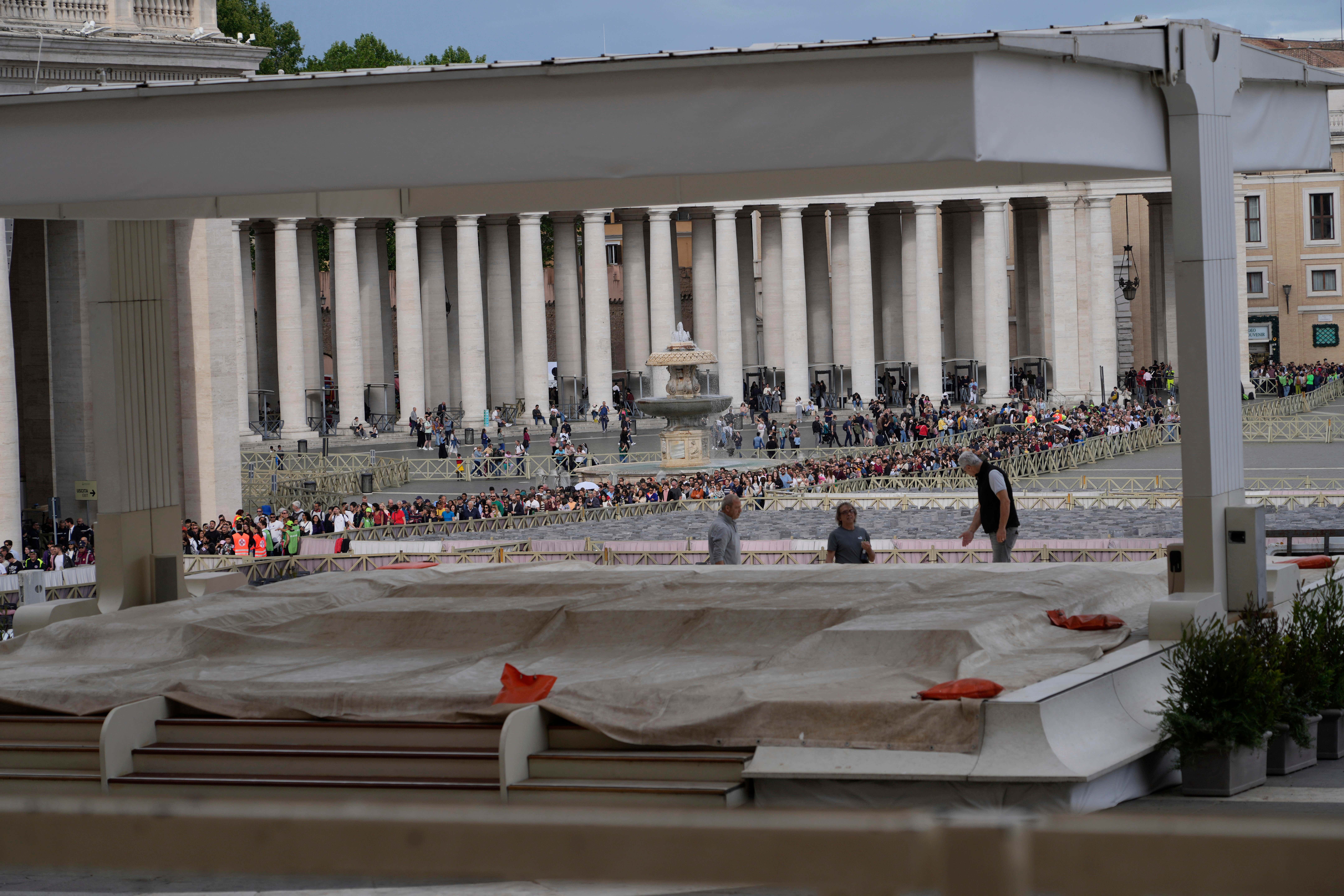 Workers set up the altar for the funeral ceremony of Pope Francis, in St Peter’s Square at the Vatican