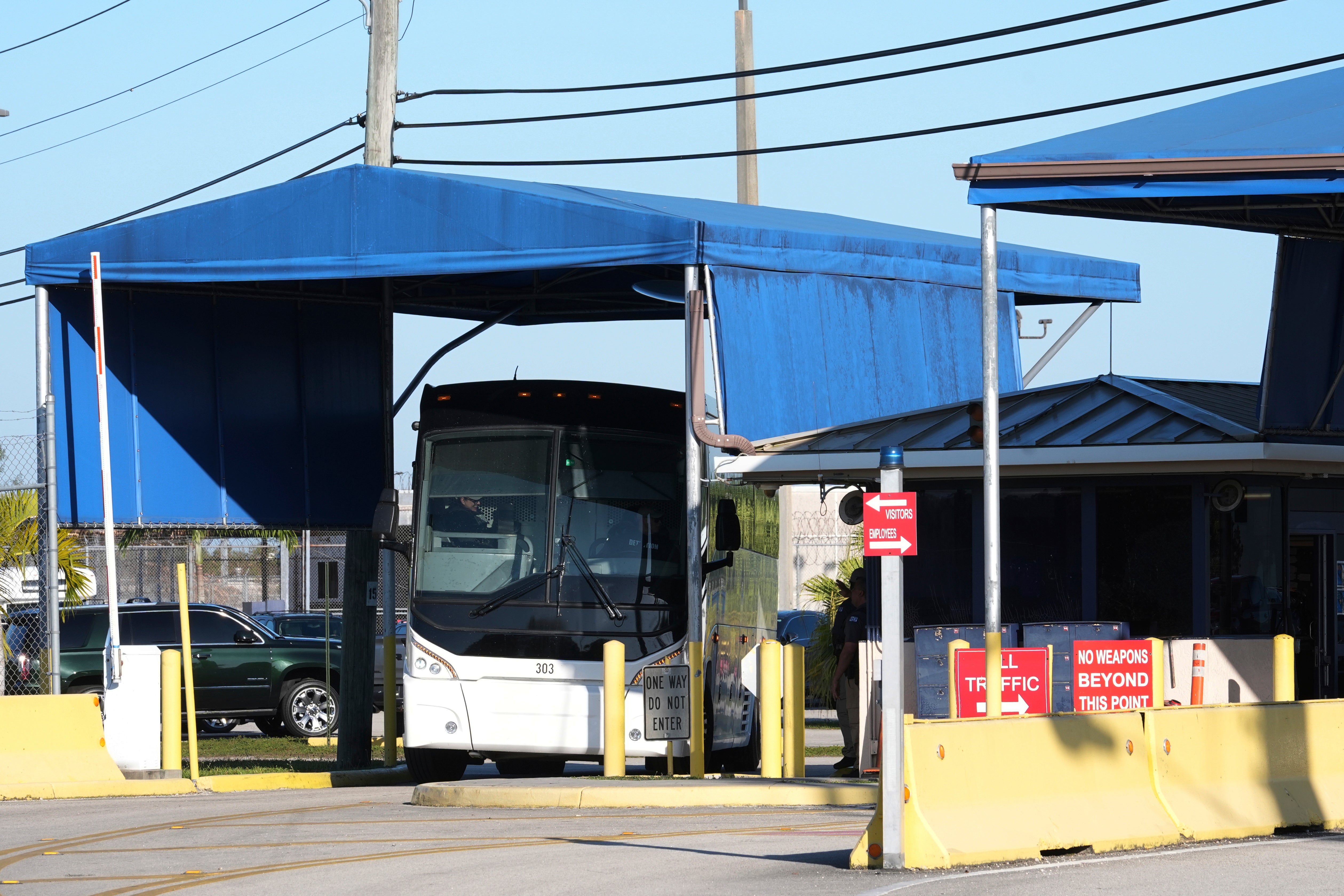A bus leaves the Krome Detention Center, Wednesday, April 16, 2025, in Miami. (AP Photo/Marta Lavandier)