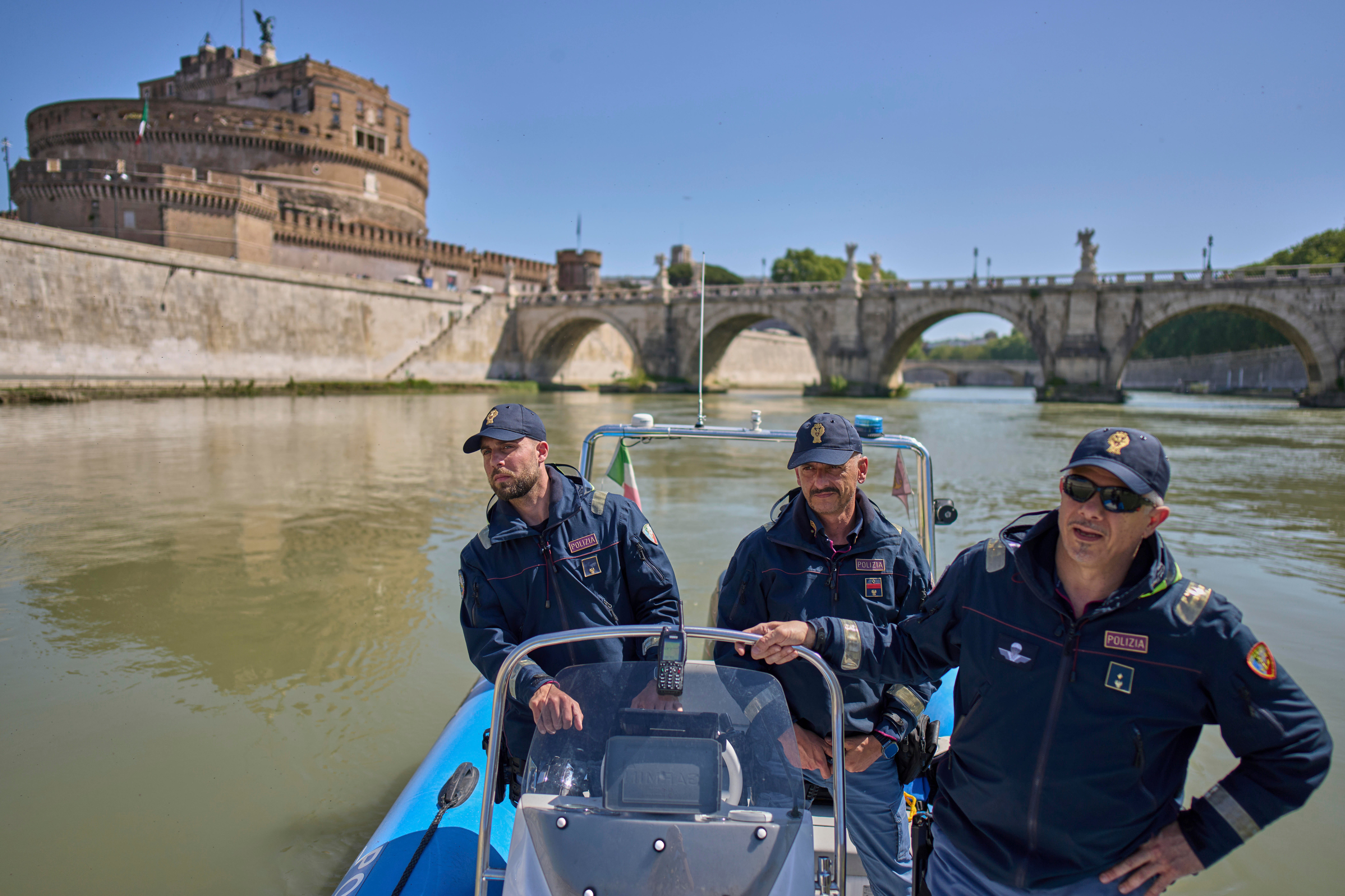 Italian police officers patrol on the Tiber river near the Vatican in Rome