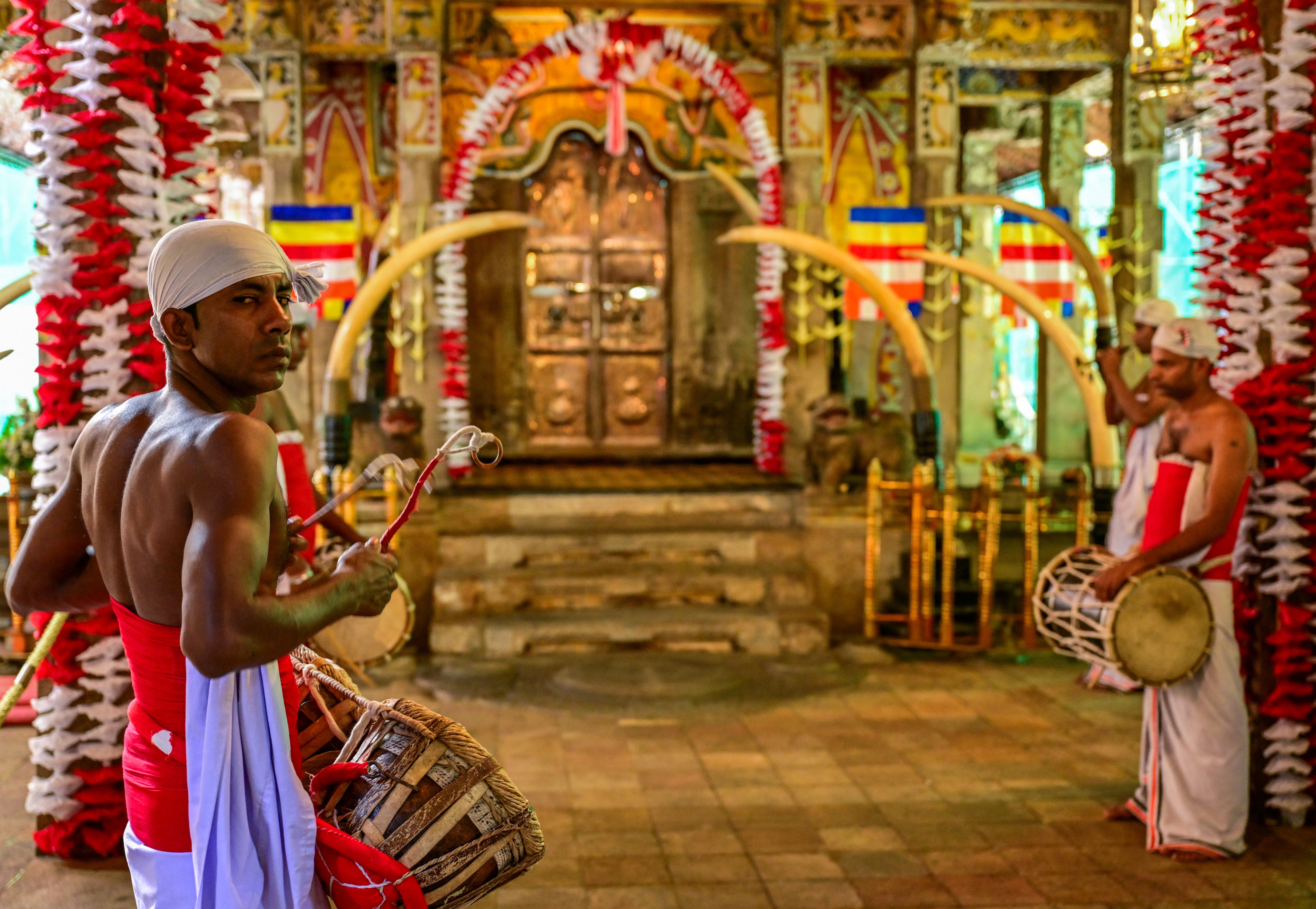 Buddhist drummers play at the Temple of the Sacred Tooth in Kandy on 18 April 2025, ahead of a sacred exhibition of what Sri Lankans believe to be Buddha's left canine
