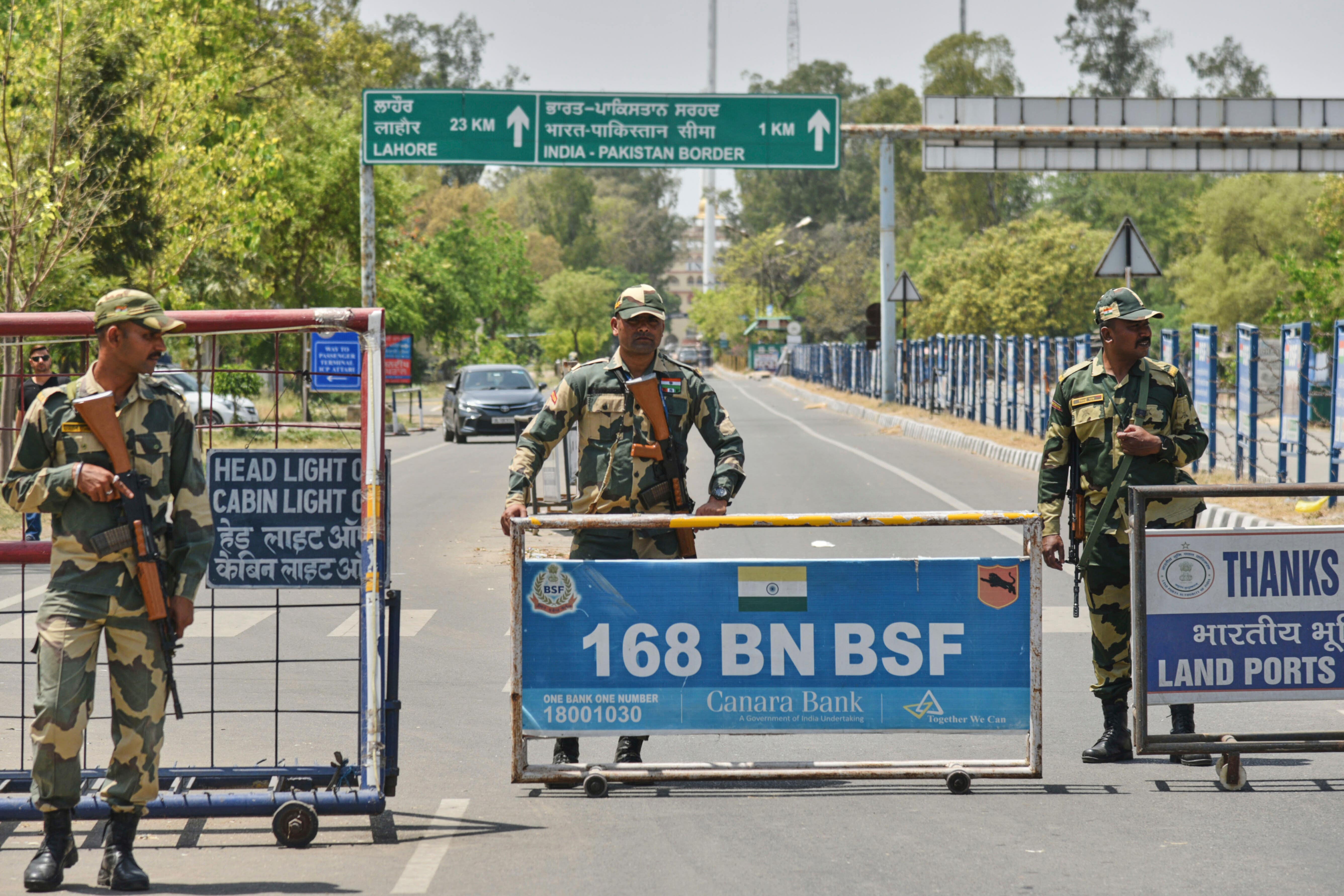 Soldiers stand guard on the road leading to the Attari-Wagah border on India’s side