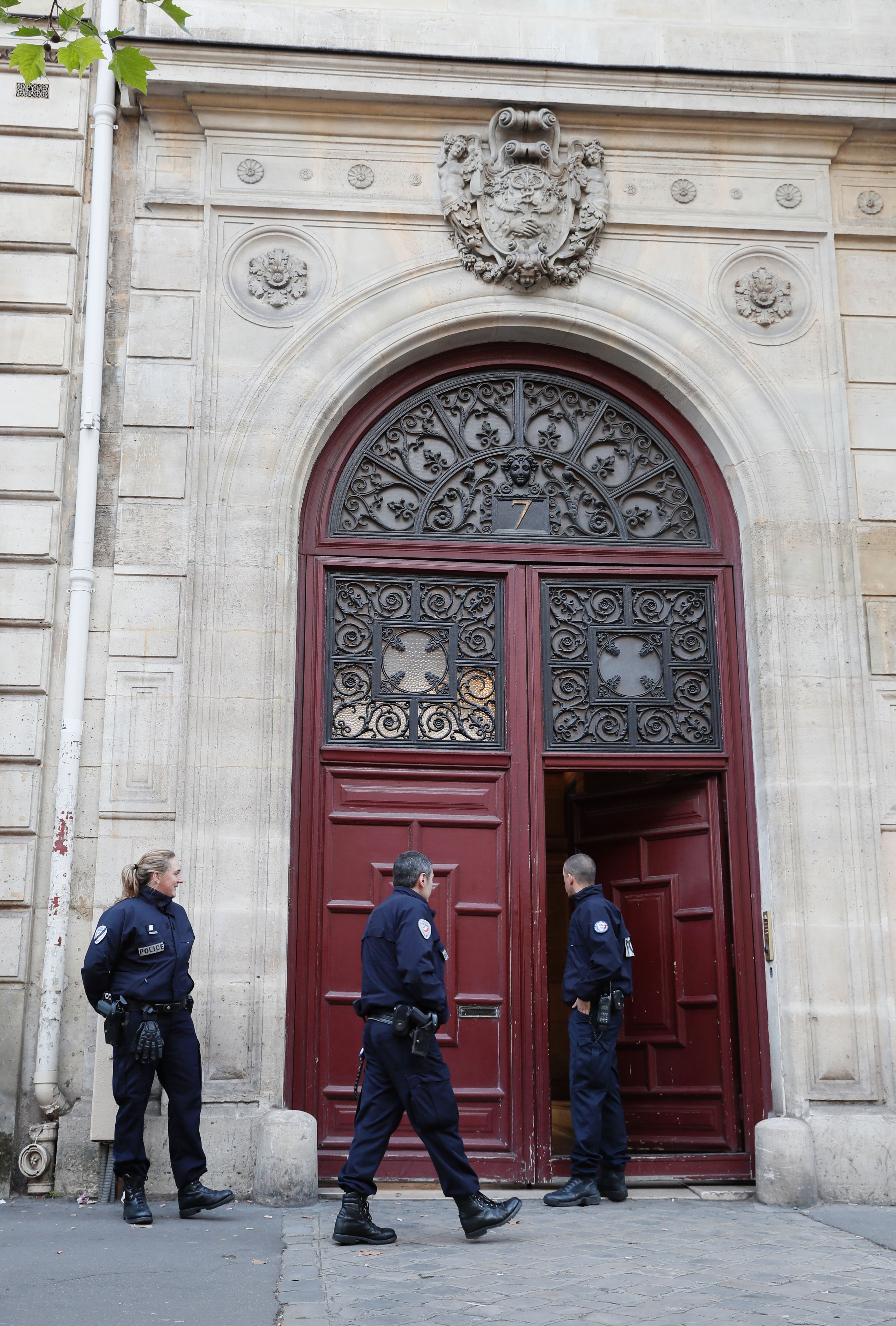 The robbery took place at the Rue Tronchet. This picture shows police standing guard outside the apartment building after the robbery